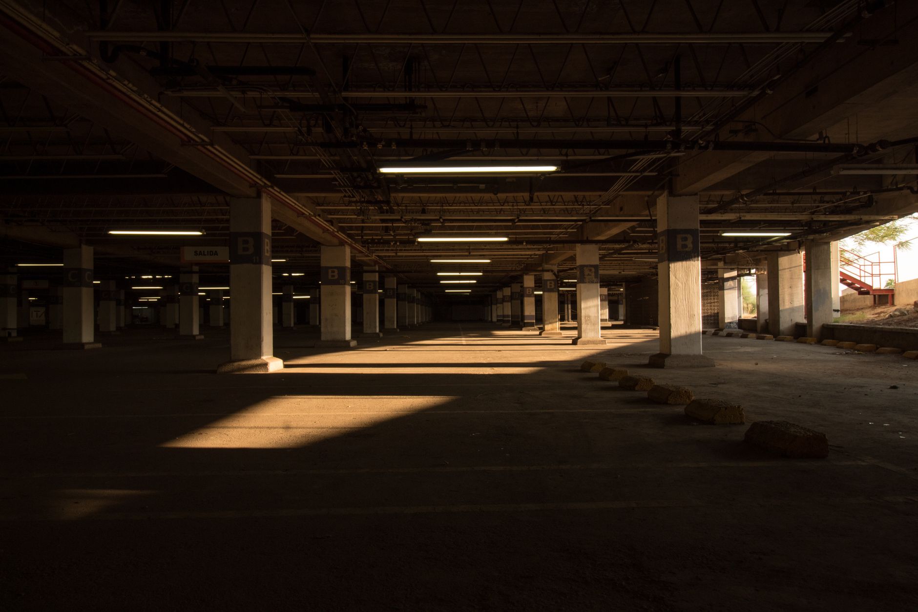 Mostly empty parking level staged for a partial closure during overnight deck inspection.