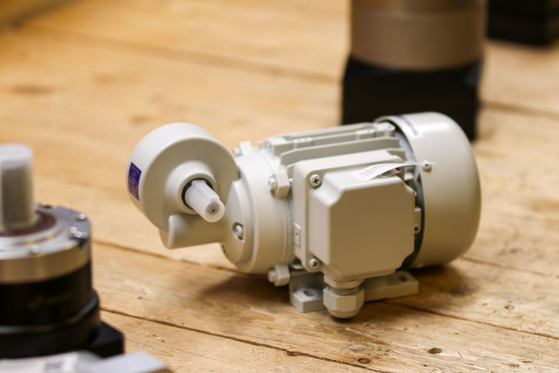 Large industrial drive motors and belt machinery in a mechanical equipment room.