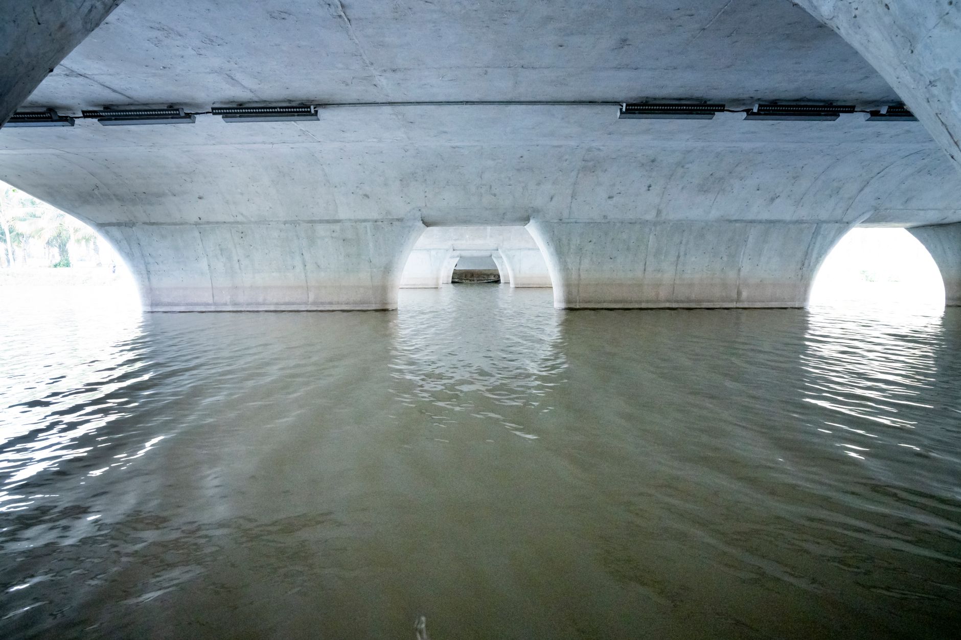 A concrete stormwater channel interior showing the scale and geometry robots must navigate beneath grade.