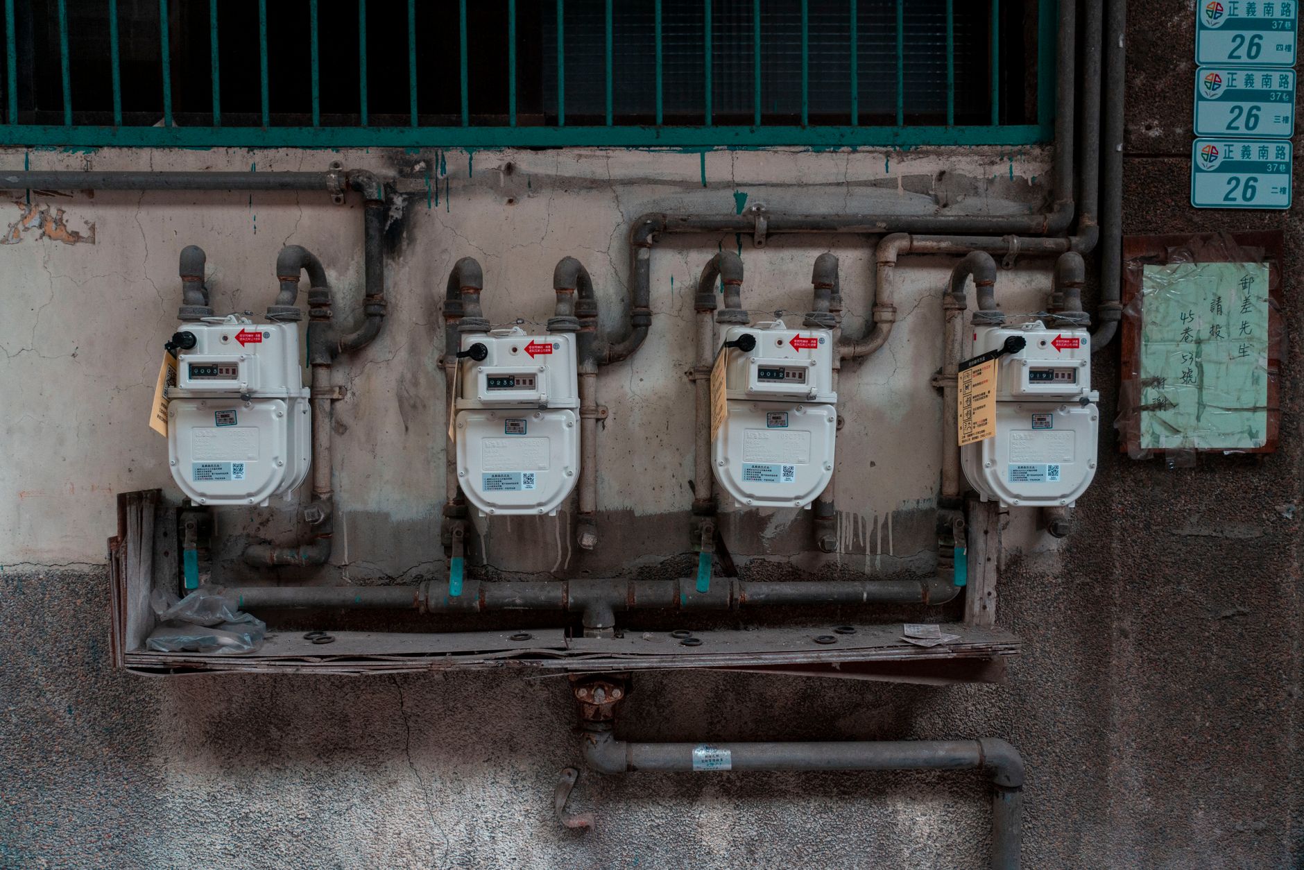 Handheld gas monitor used near a confined industrial space, supporting the section on atmospheric awareness during remote inspections.