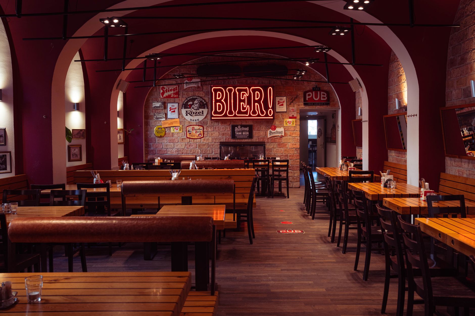 Close view of a brewery bar floor where spills collect near high-traffic standing areas.