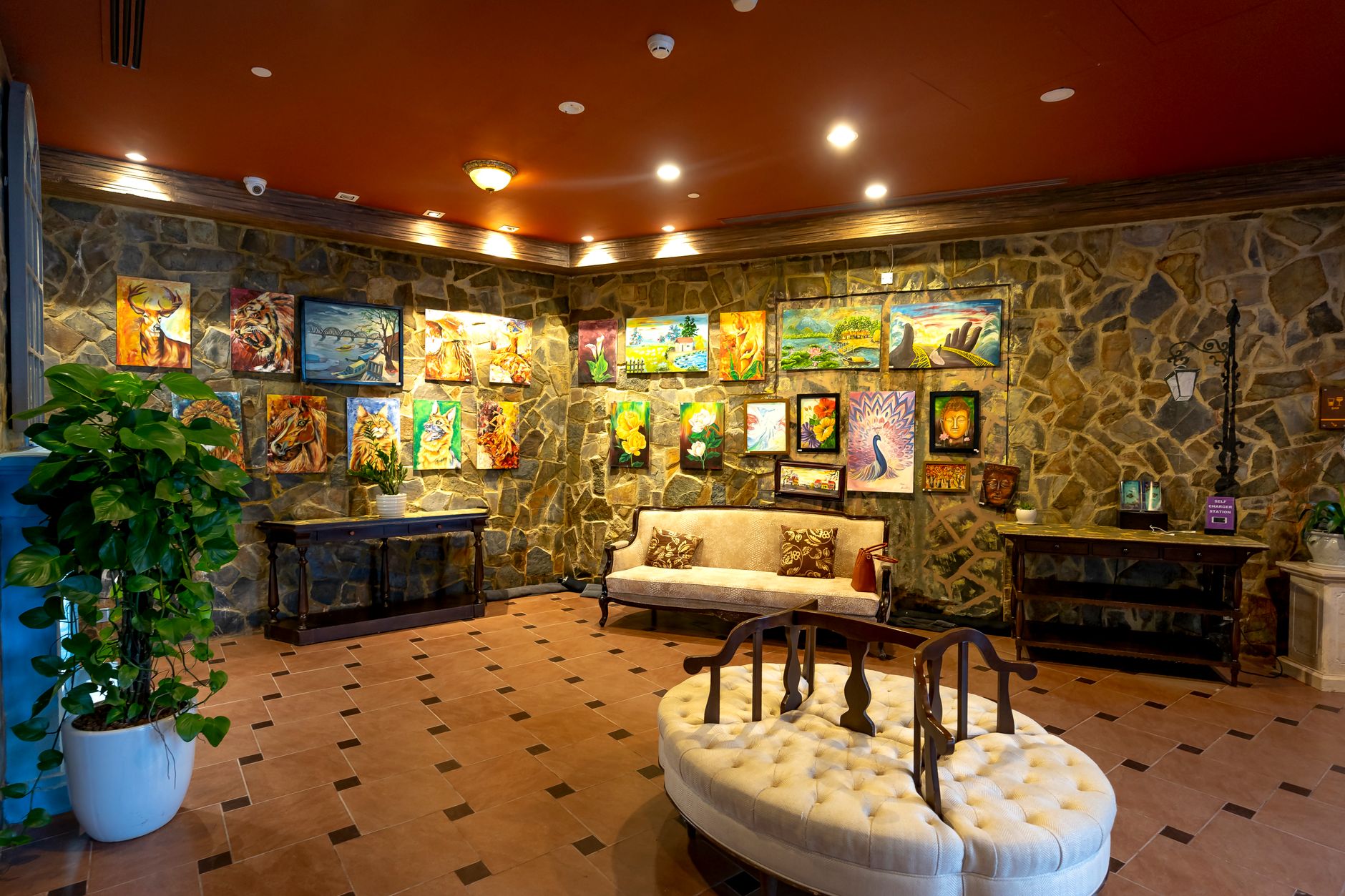 Small gallery or inn lobby with hard flooring and display space