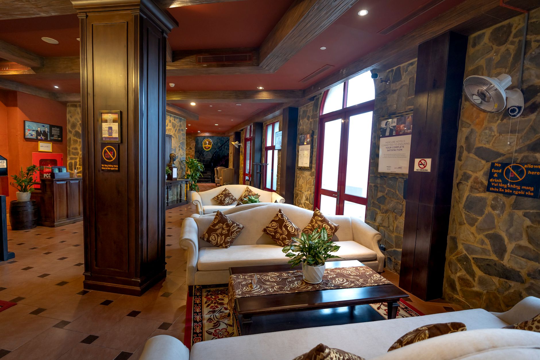 Mountain lodge lobby with hard flooring and front desk area