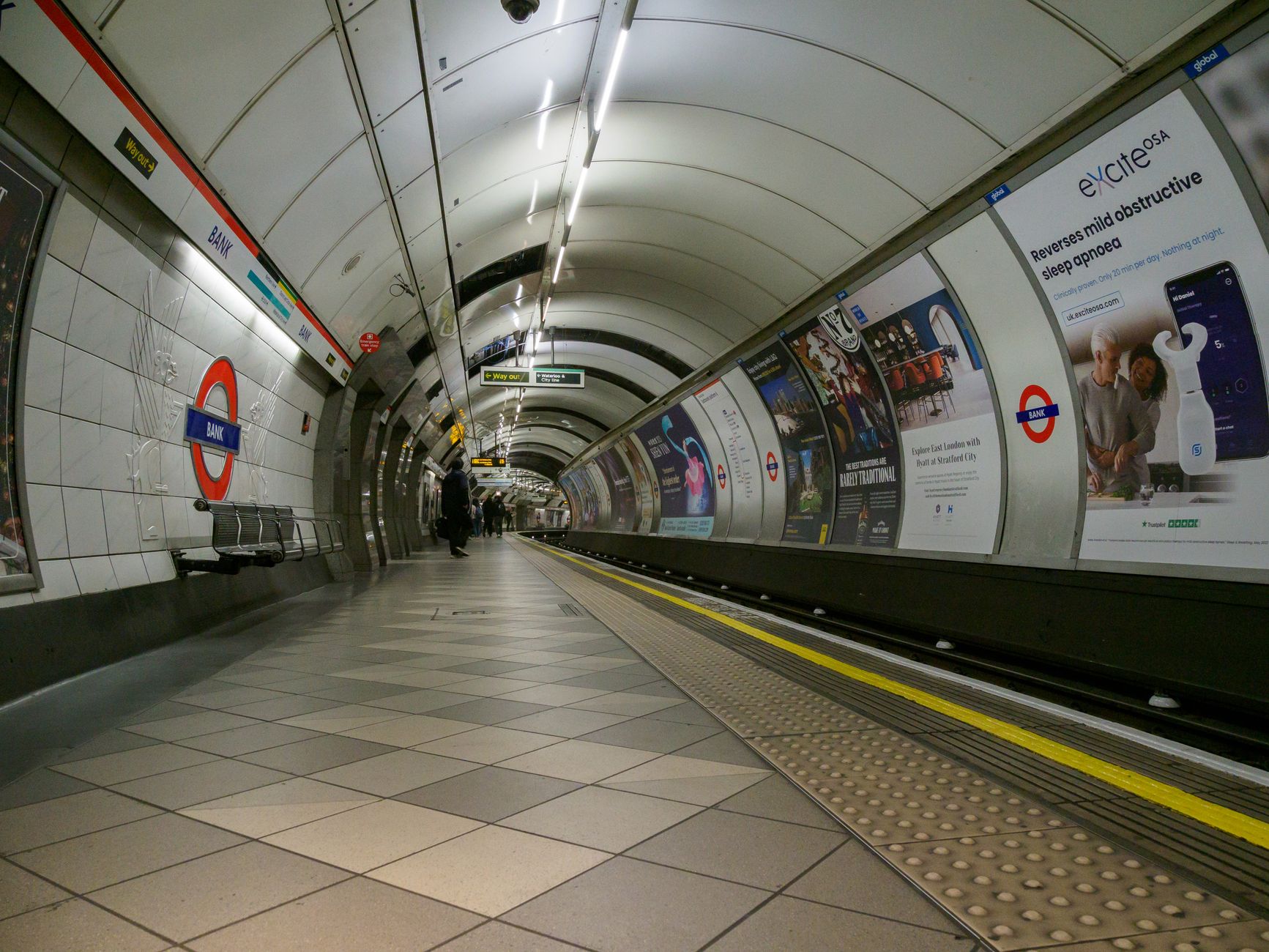 Tile concourses that show wear quickly after rush-hour foot traffic.