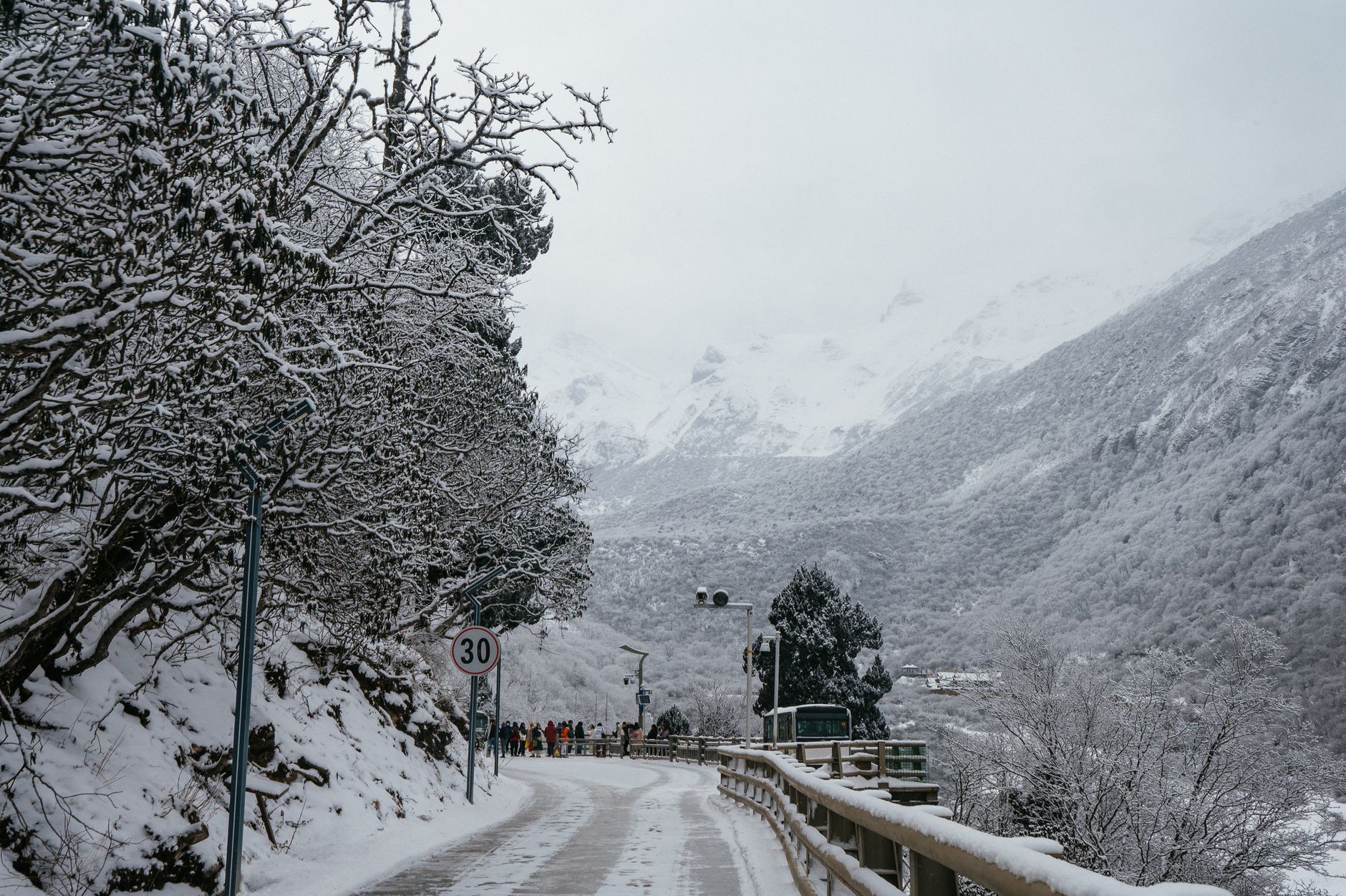 A snowy main street in a high-altitude Colorado town, illustrating melt and grit tracked indoors after cold nights.