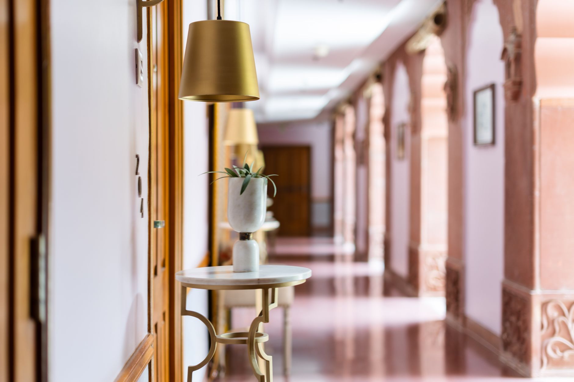 A clean, quiet, and well-lit hotel corridor, showing the kind of consistently excellent environment that autonomous cleaning robots help maintain.