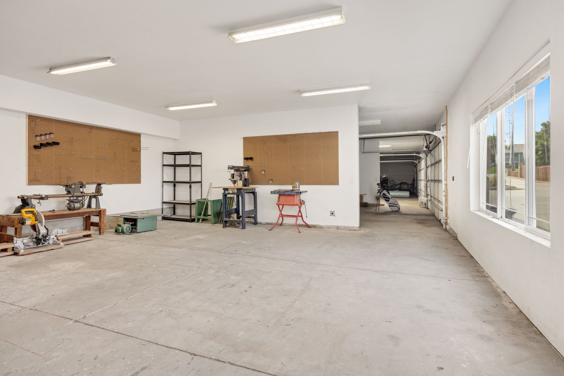 Shelving in a factory tool room illustrates the small, frequent parts and gauge runs that consume skilled time.