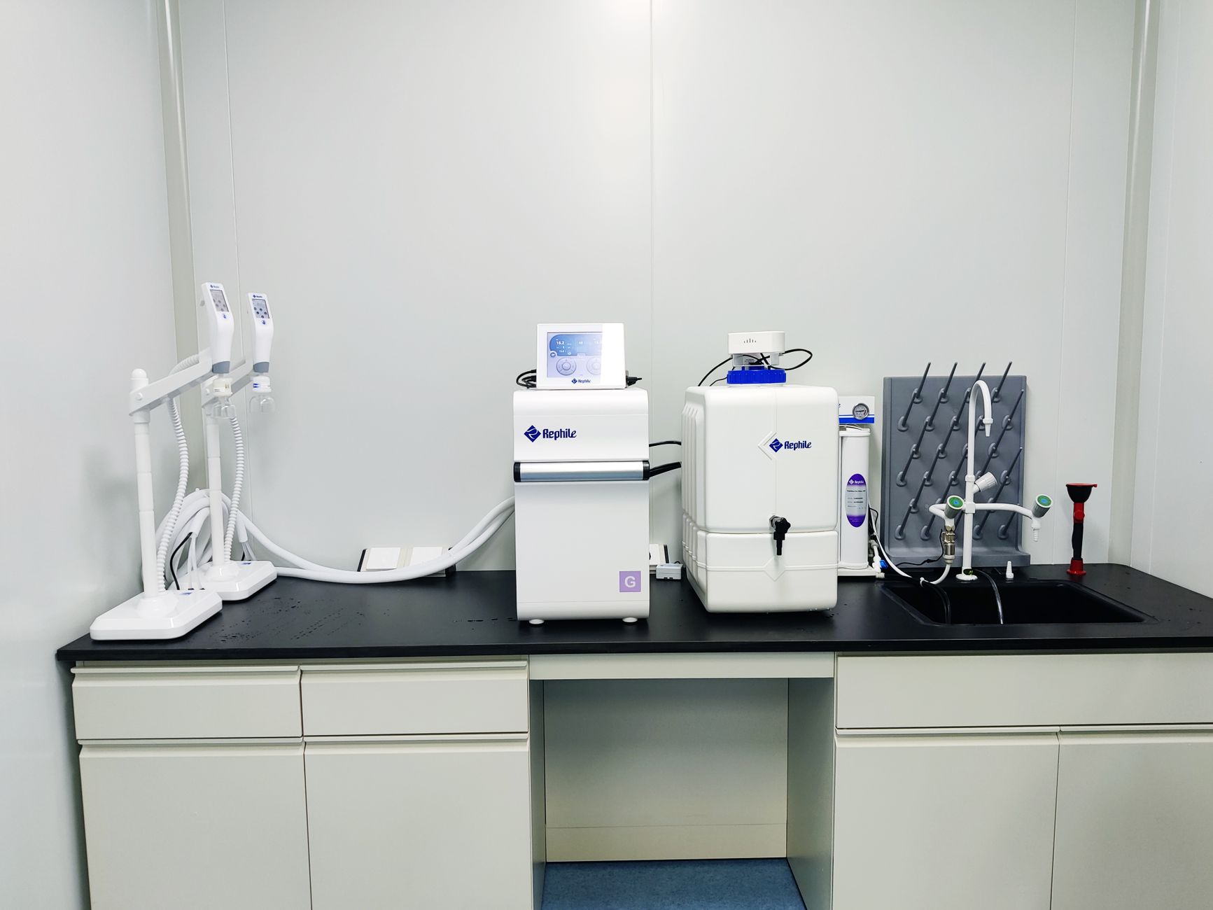 A quality lab bench with instruments and paperwork shows the handoff points and route discipline that make internal transport loops workable.