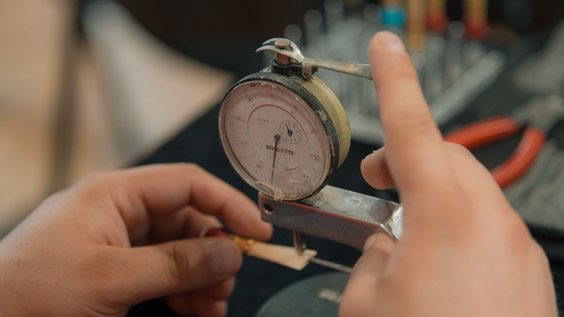 A technician carefully calibrating measurement equipment used for reliable environmental observations.