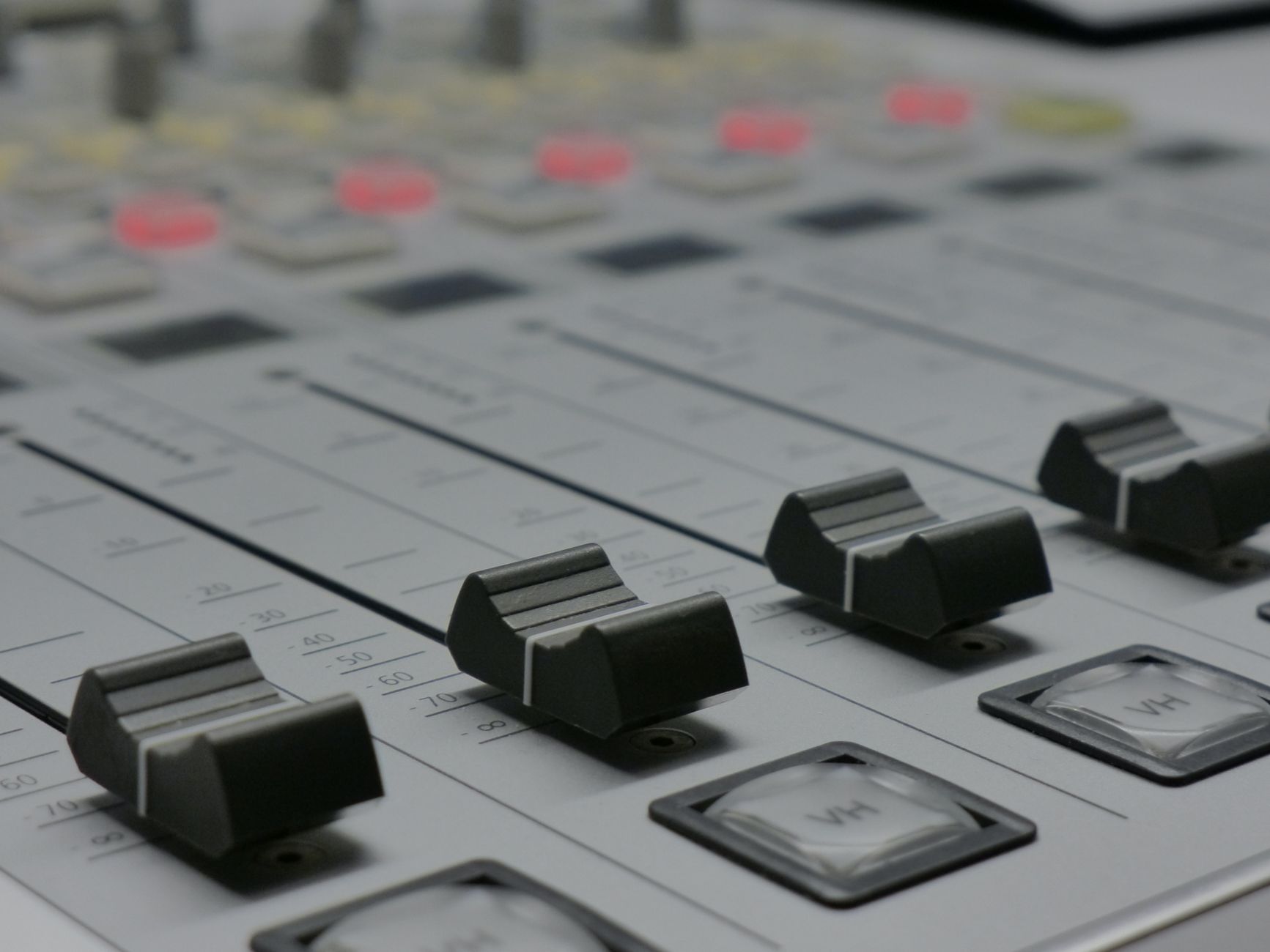 A recording control room representing the sound-sensitive spaces near an active stage.
