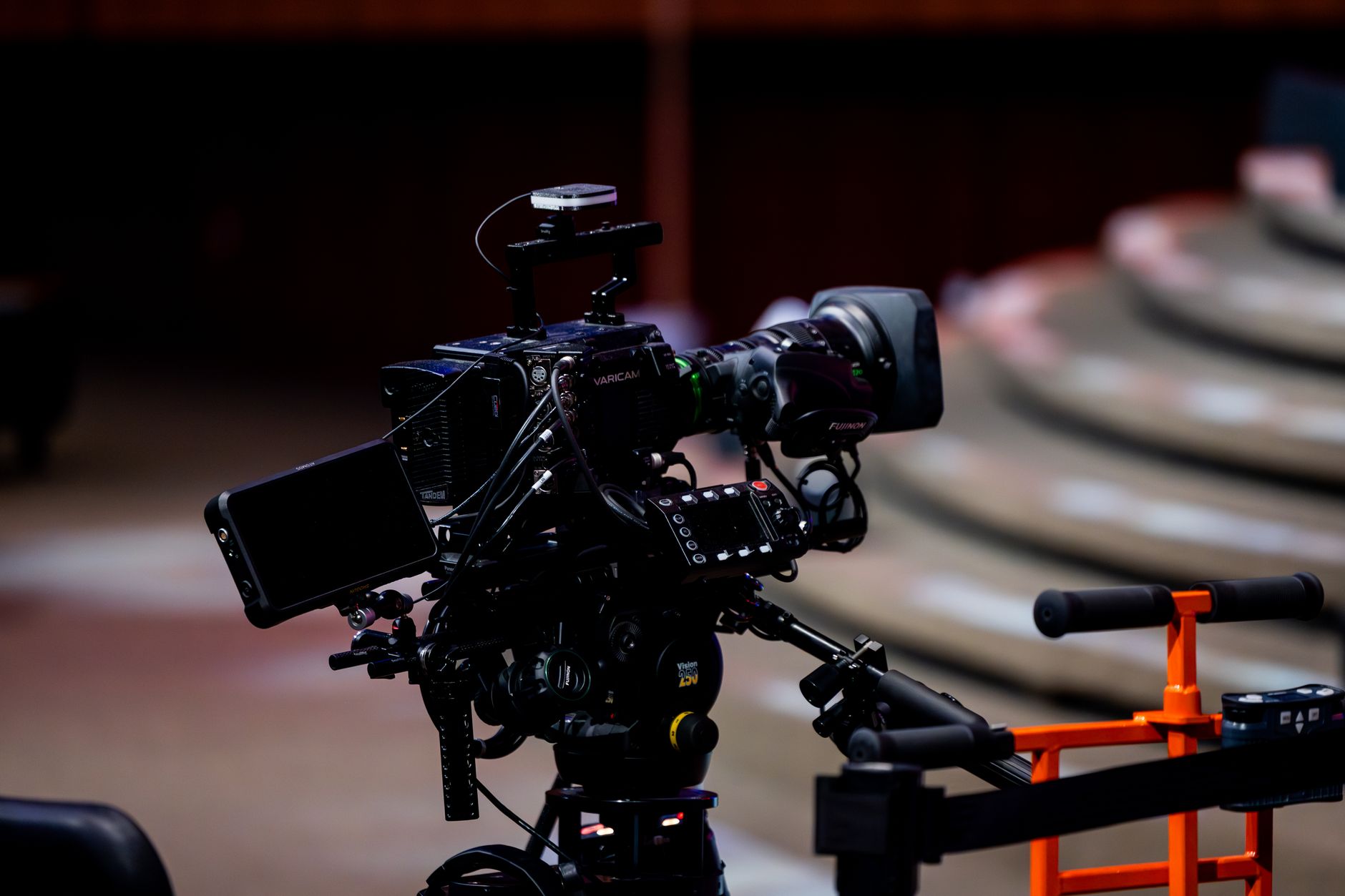 An empty film soundstage with a broad floor ready for overnight cleaning.
