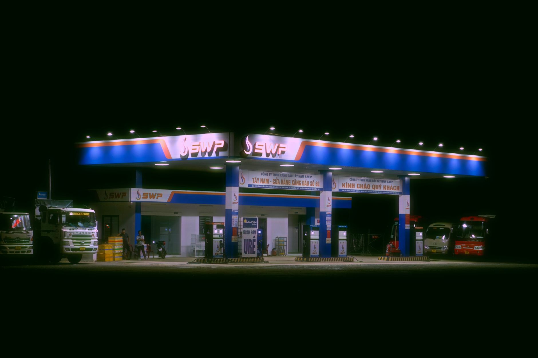 Farm fuel island and yard lighting where patrol loops add overnight coverage.