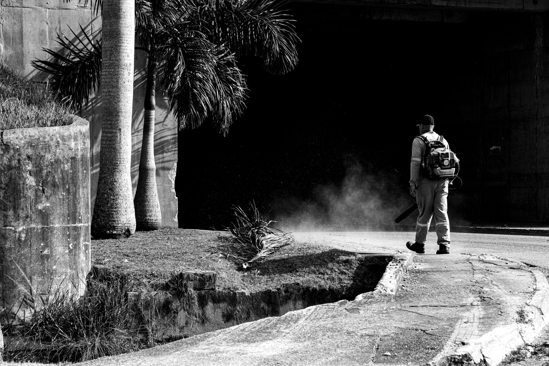 Crew blowing debris off a fairway corridor