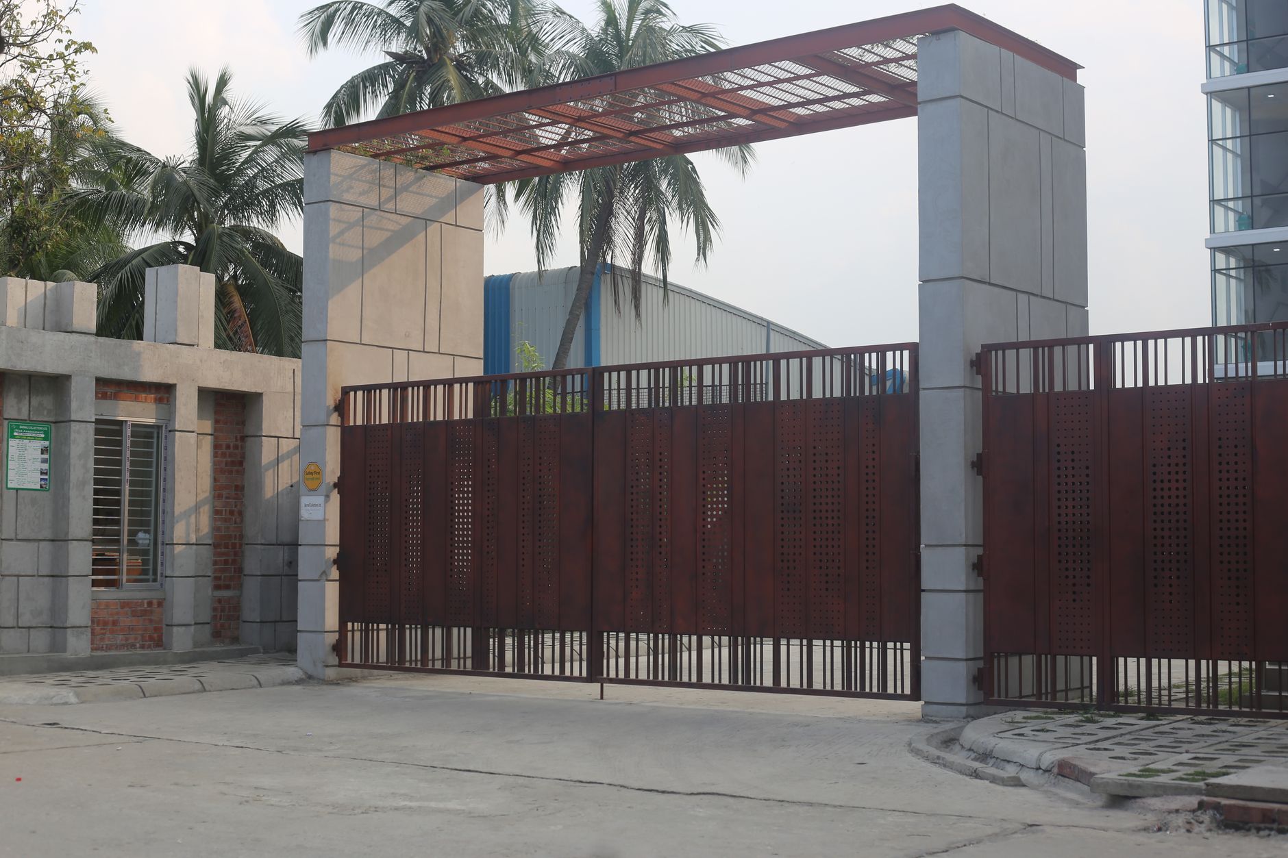 A secured industrial gate and exit lane where patrol footage pairs with access control logs.