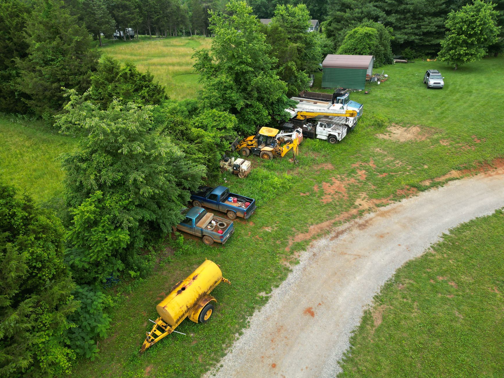 A rough gravel utility yard illustrates the uneven surfaces and obstacles a patrol route must accommodate.