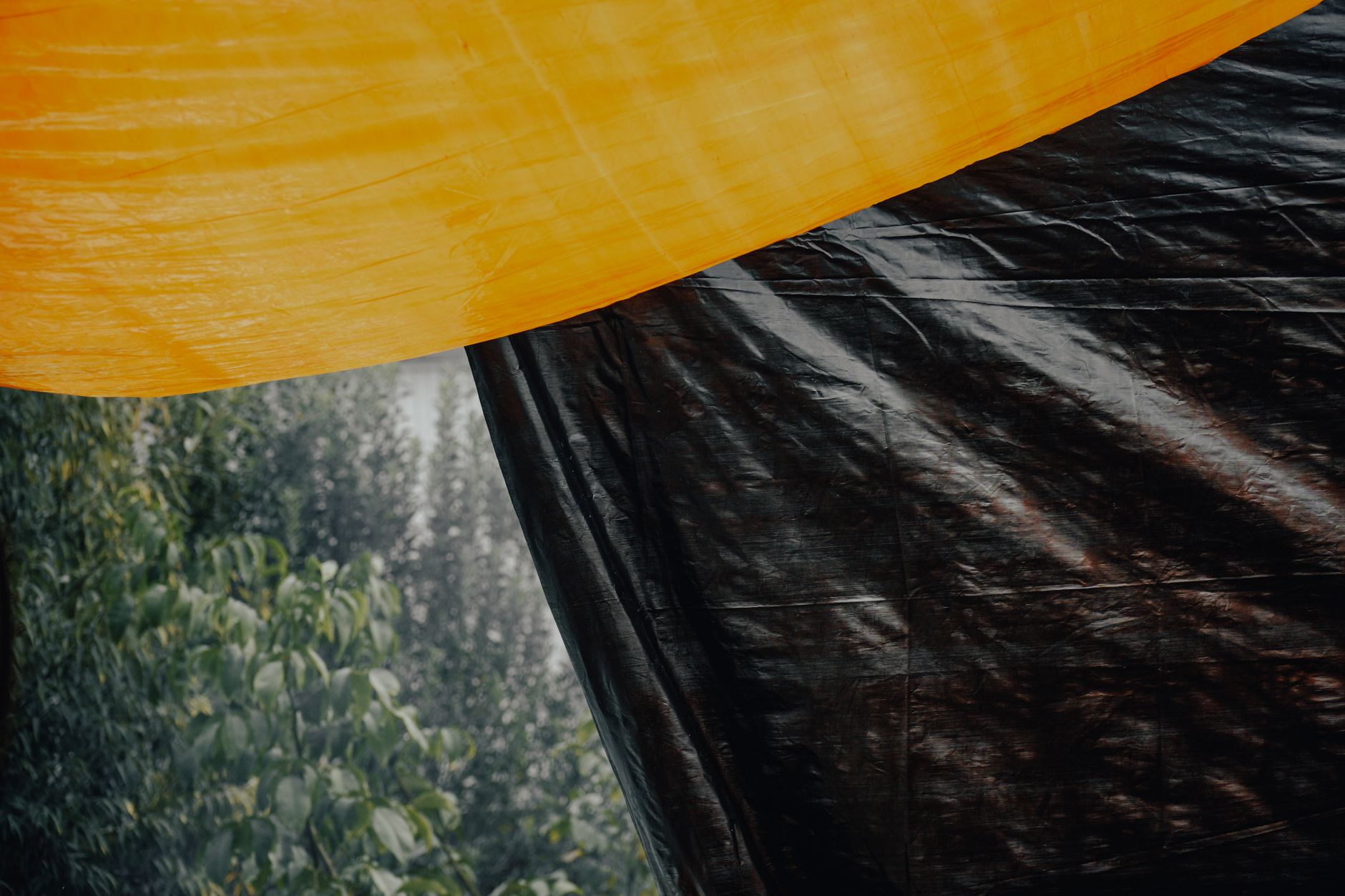 Wind-blown tarps and covers that can trigger motion alerts in outdoor storage yards.