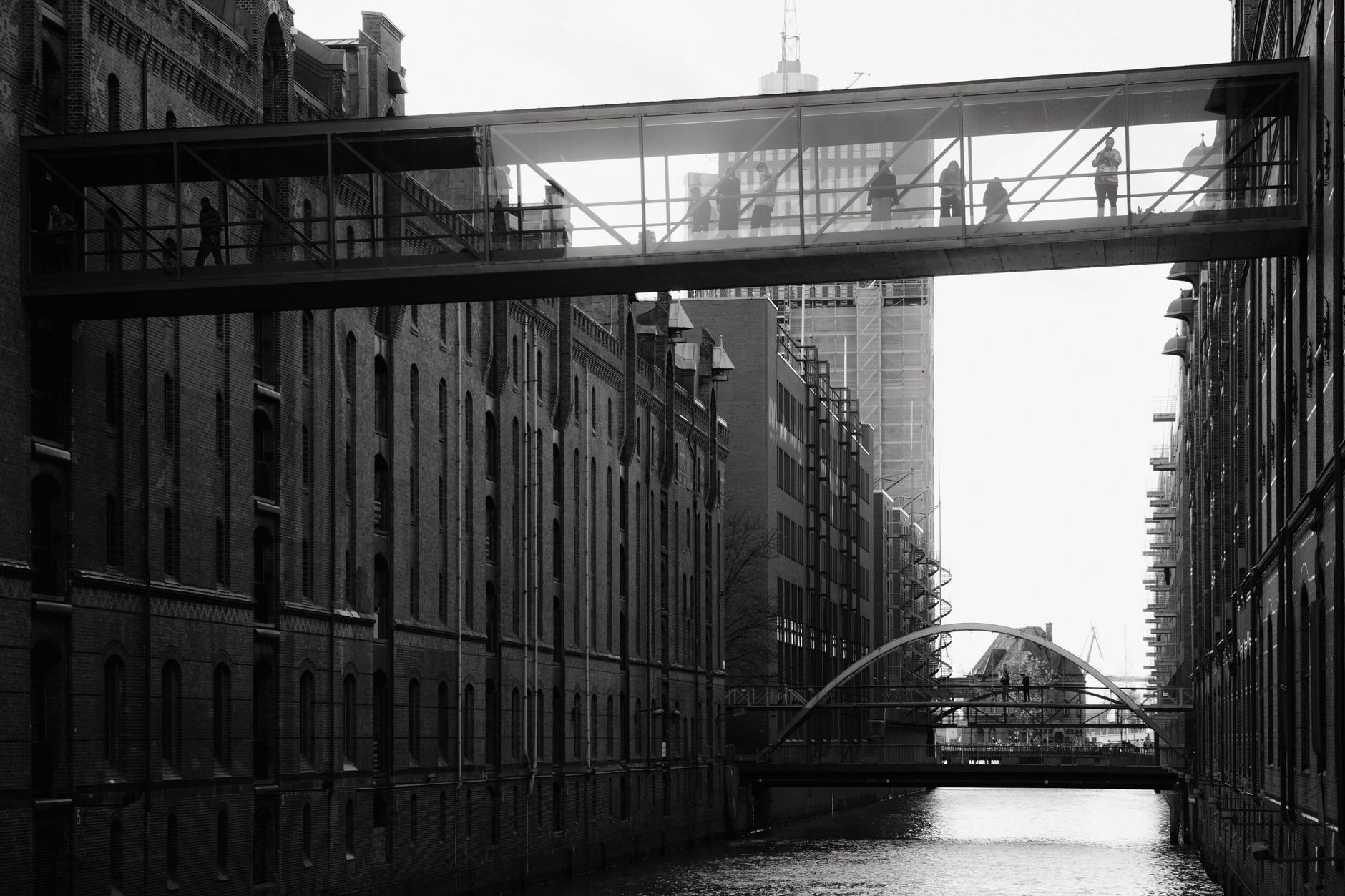 Marked pedestrian walkway leading to a gated crossing at a distribution dock.