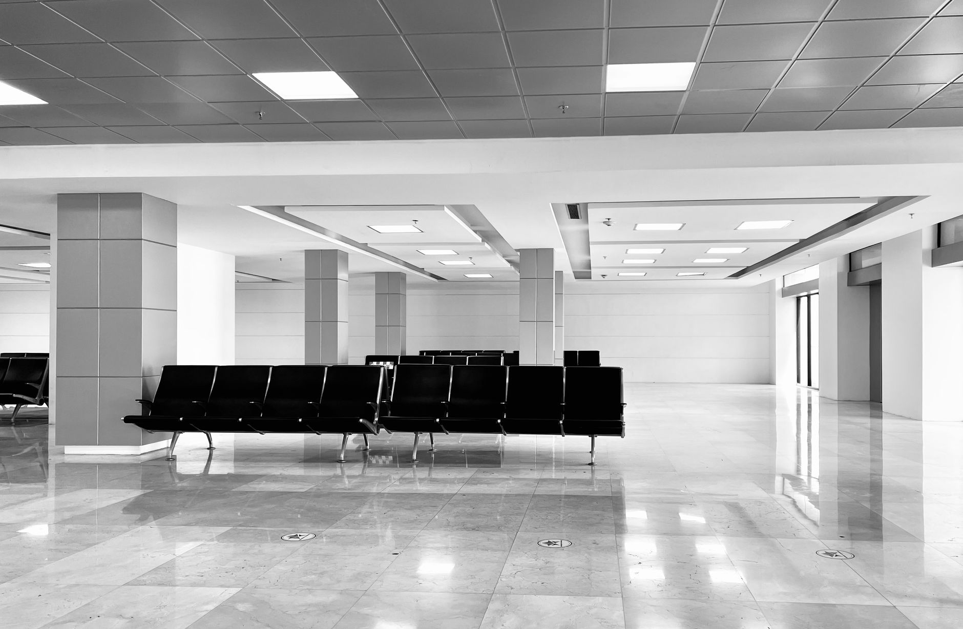 Reflective tile flooring in an airport walkway