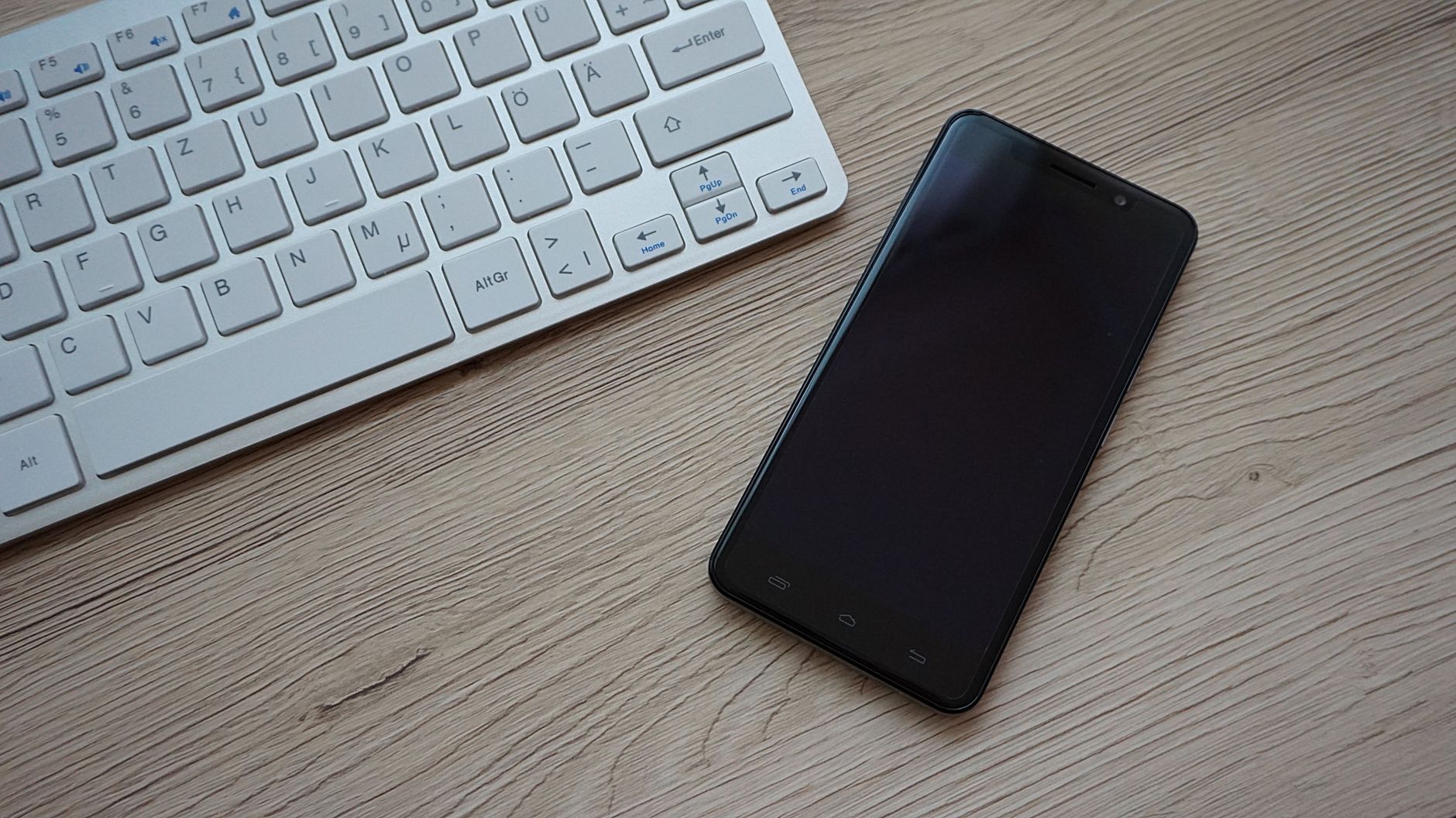 An office worker using a smartphone, illustrating app-based dispatch that needs a fast login and short summon flow.