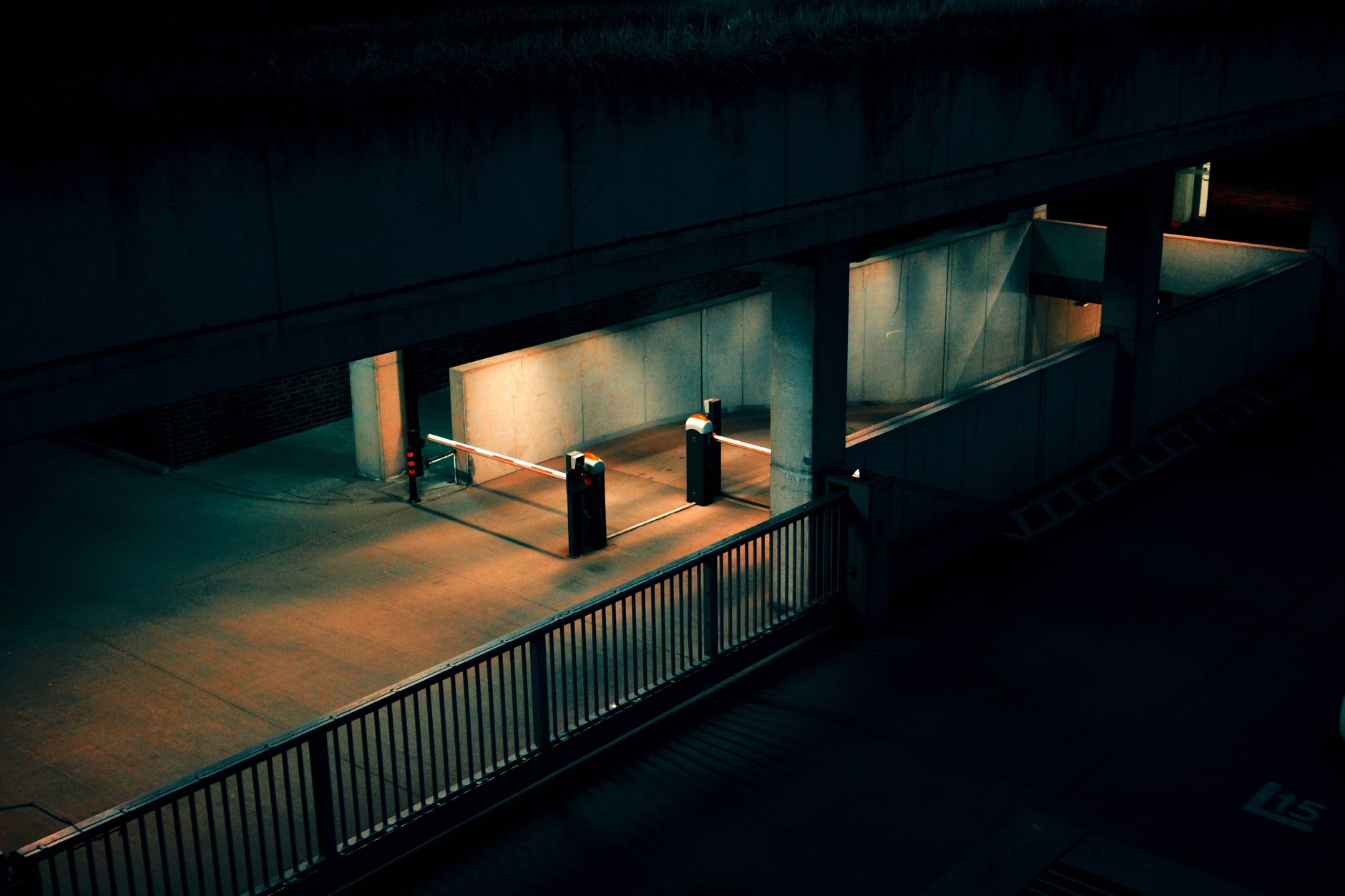 Parking structure and gate lane where patrol loops add overnight camera coverage.