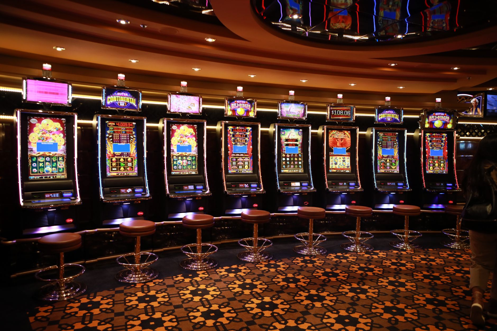 Quiet casino aisle with tile flooring prepped for overnight autonomous scrubbing.