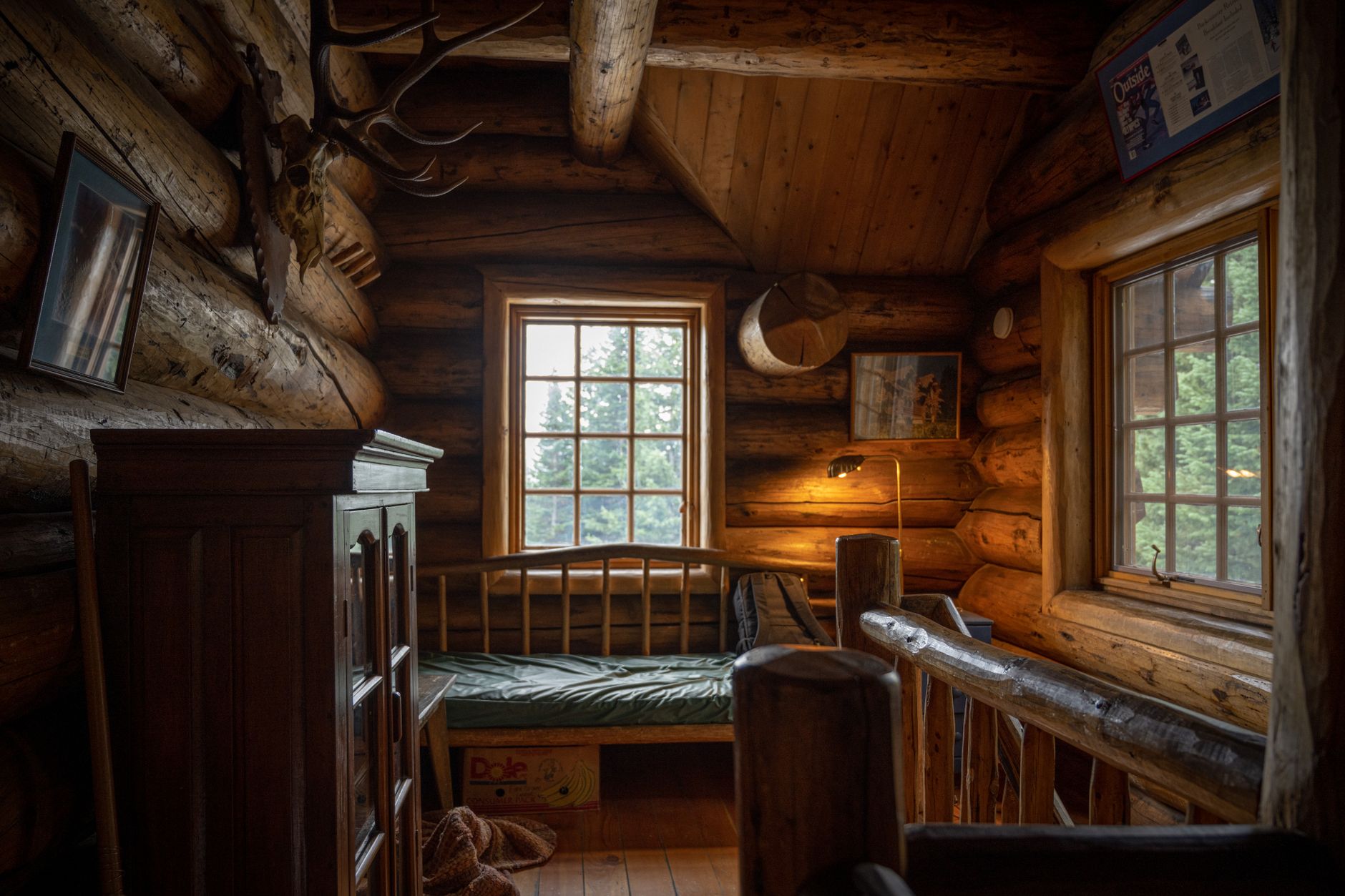 Warm-lit bar and dining area with hard floors in a Colorado mountain lodge