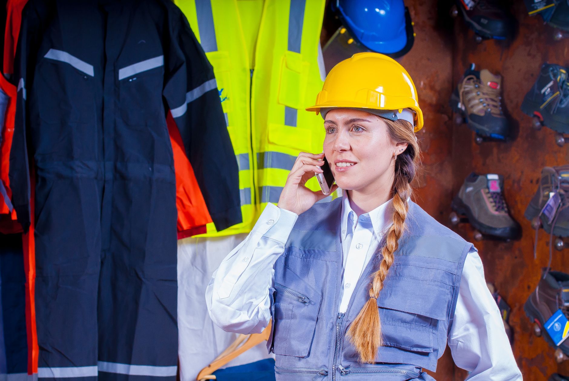 A person in a hard hat inside a facility, emphasizing the crucial safety compliance and risk assessment expertise that certified integrators bring to a project.