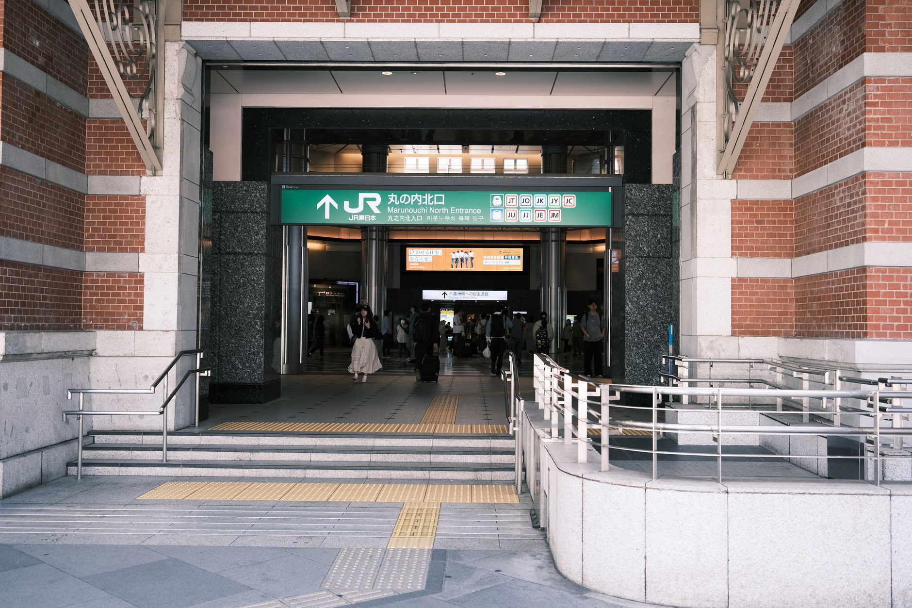 Transit-style entry zone with mats and heavy foot traffic, highlighting how moisture, debris, and circulation patterns affect cleaning equipment choice.