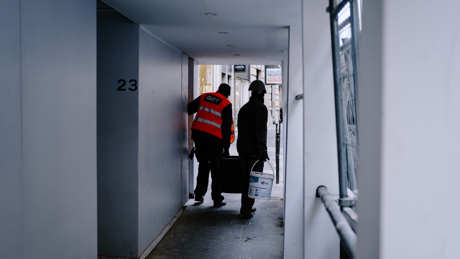 A facility technician works in a hallway, illustrating the labor involved in on-site recovery and support.