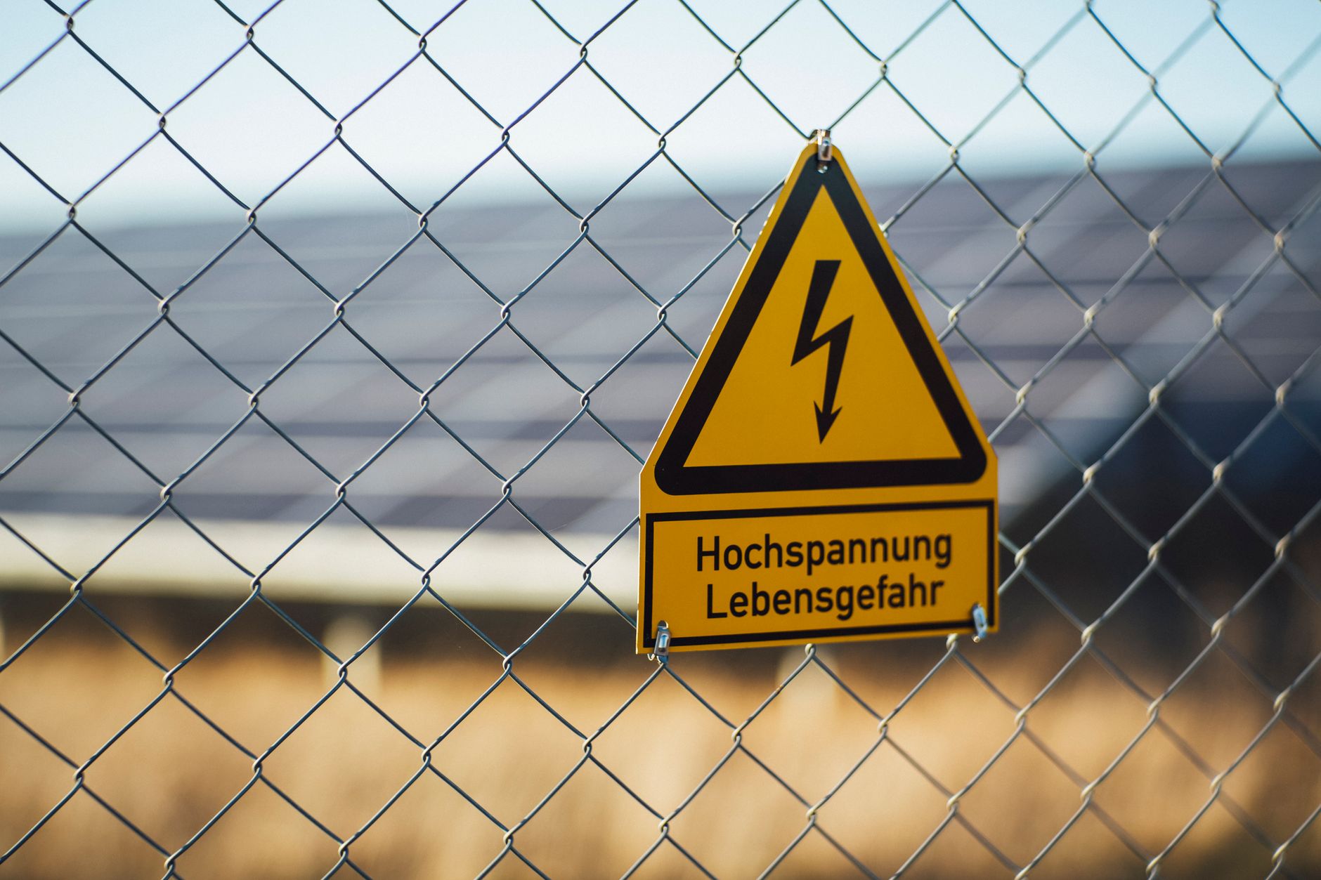 A guarded high-voltage area shows why inspection routes need approved stand-off distances and hard geofences.