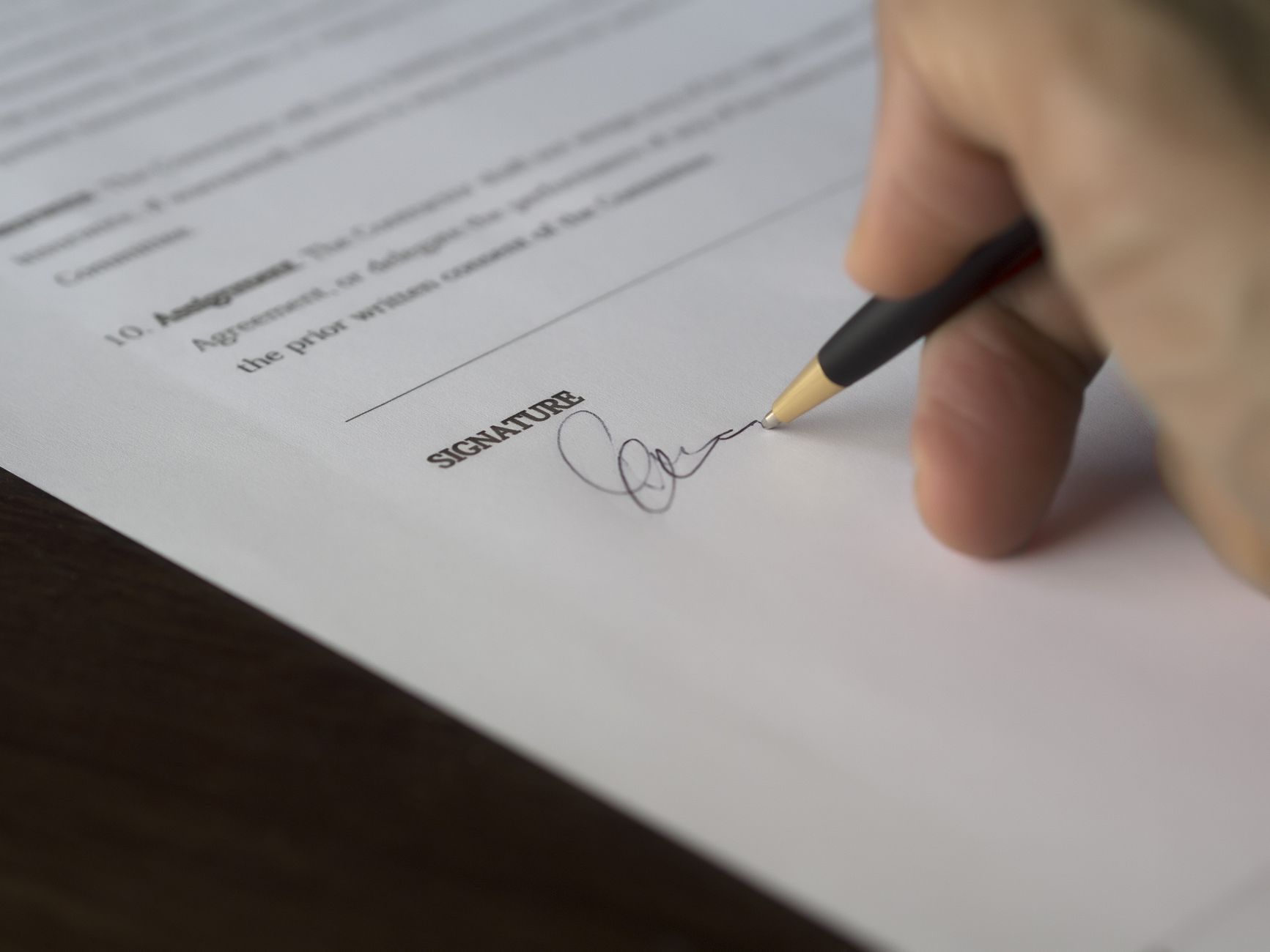 Buyer reviewing contract paperwork where robot warranty exclusions are easy to miss.