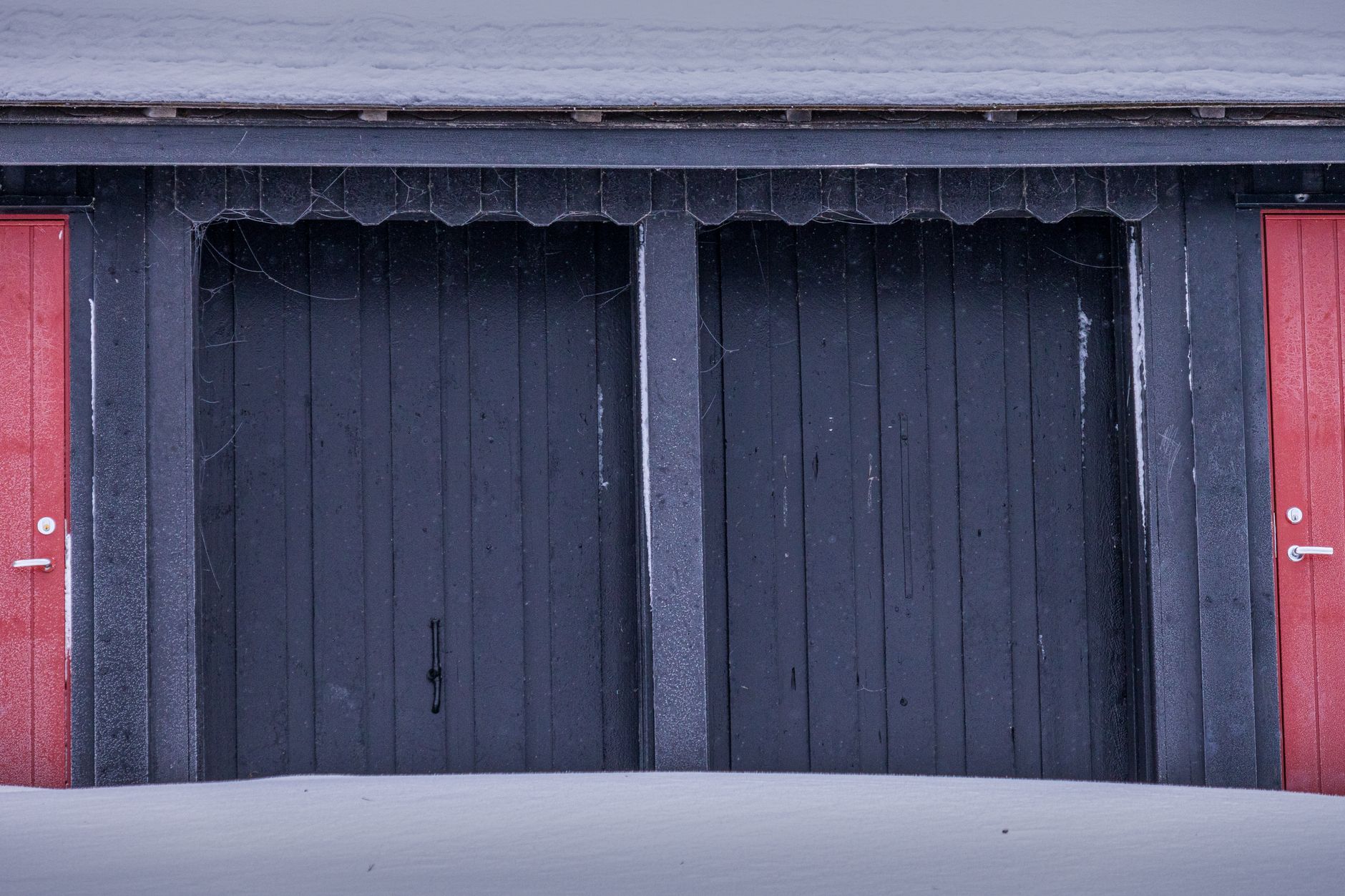A closed insulated door inside a commercial cold-storage facility.