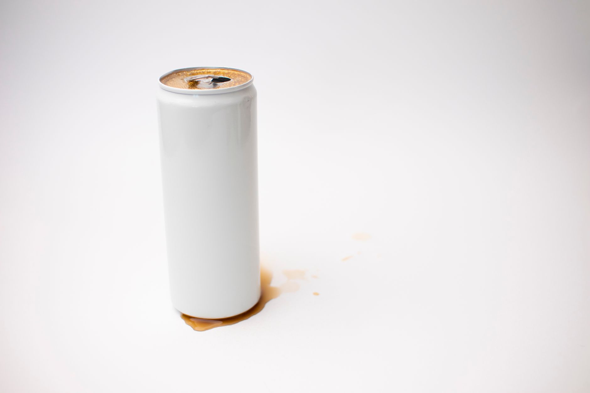A close-up of a sticky, dirty floor in a commercial space, showing residue from spilled drinks and food.