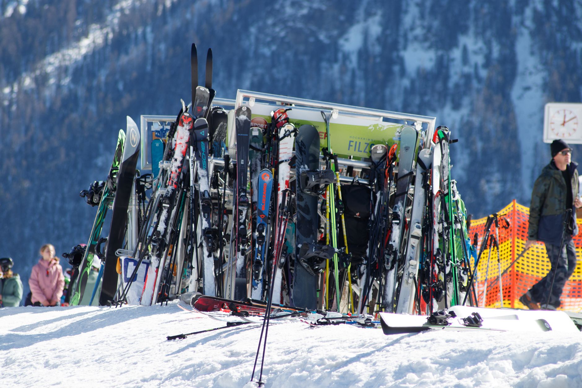 Skis stored along a narrow shop aisle illustrate the clearances a cleaning route must preserve.