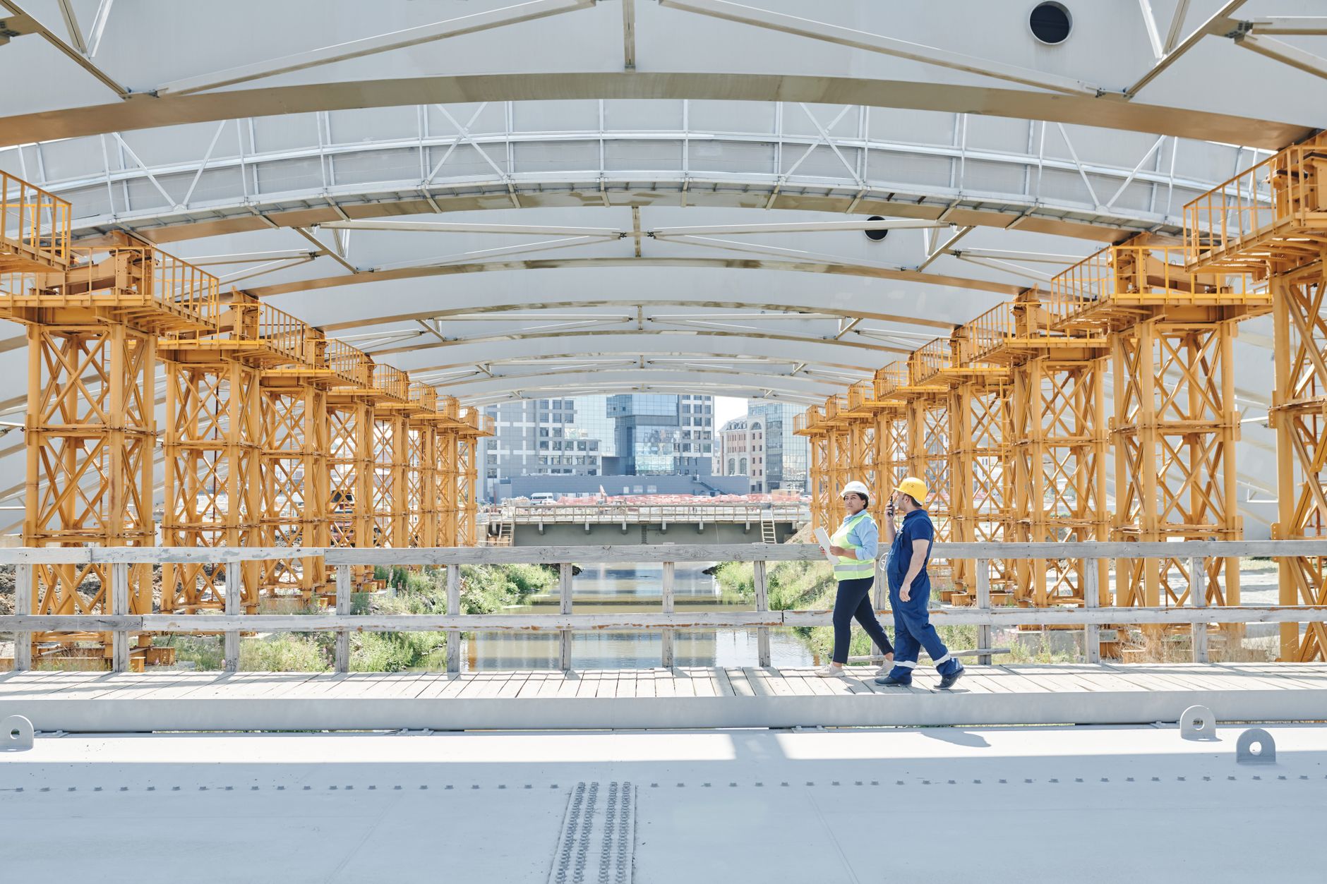 An engineer examining bridge components as part of a professional structural inspection.