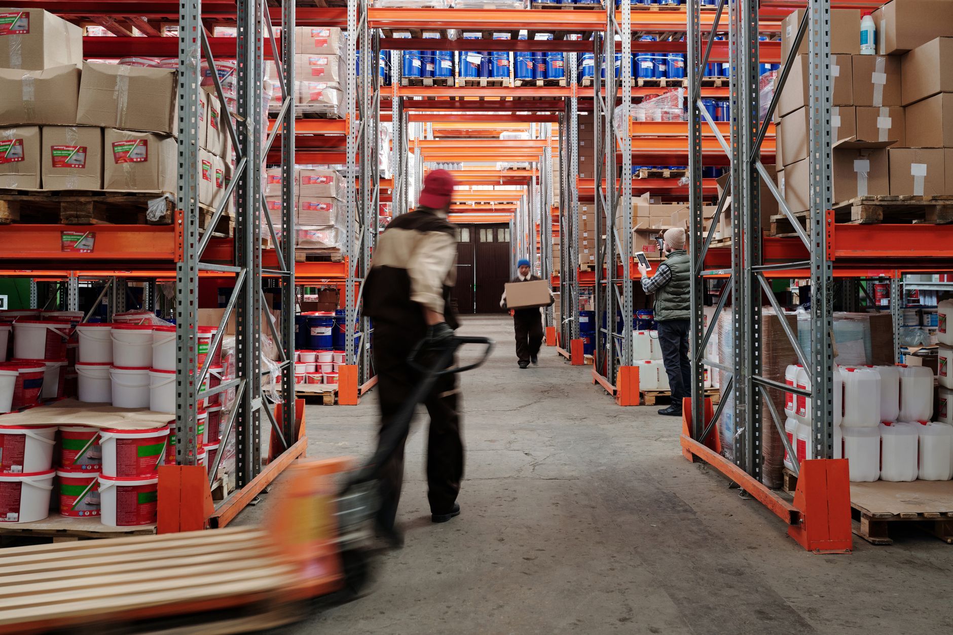 A bustling warehouse with packages ready for shipment, showcasing an environment where the scalability of RaaS is a major advantage.