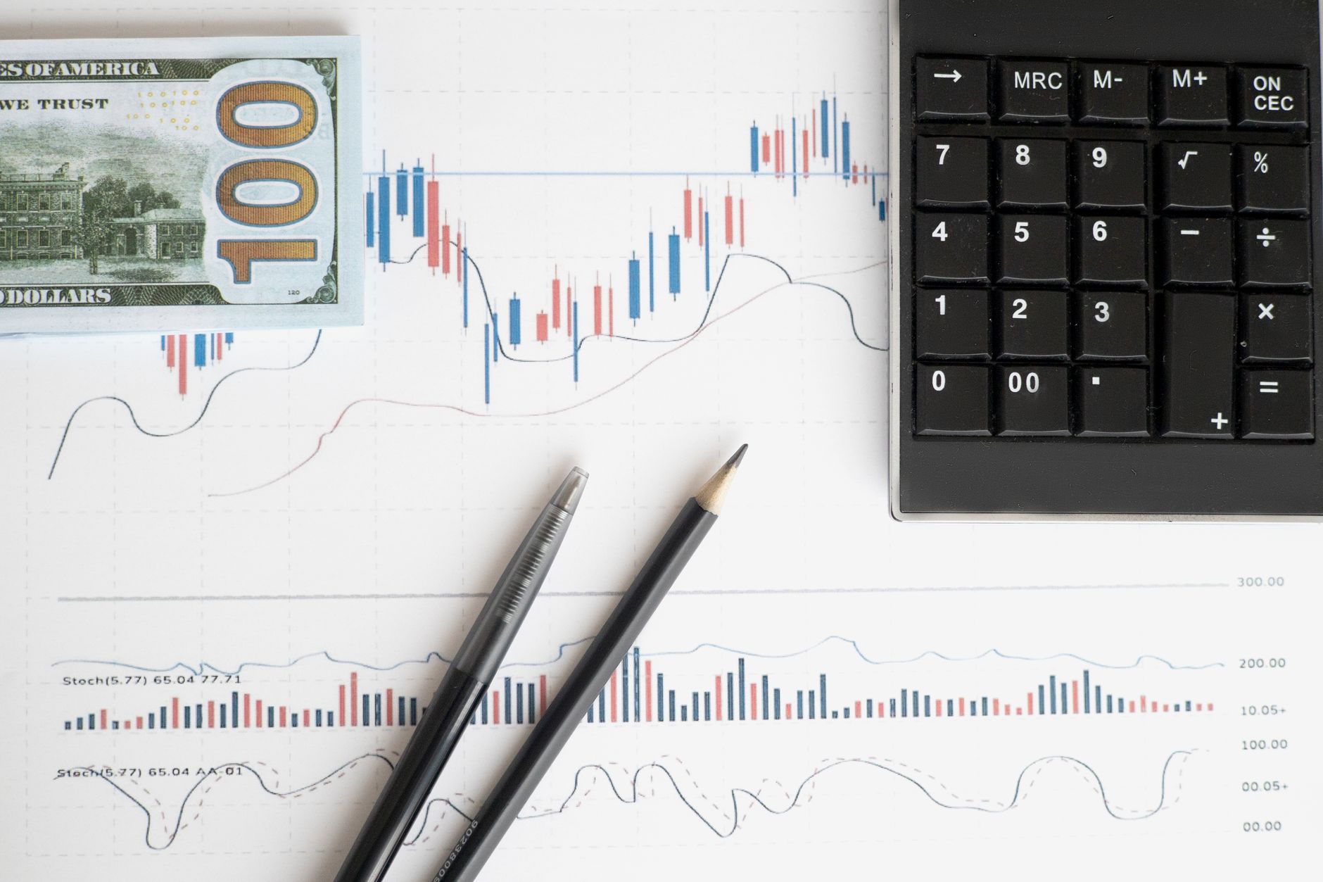A team of professionals in a meeting room, analyzing charts and data to make a strategic financial decision about capital expenditures.