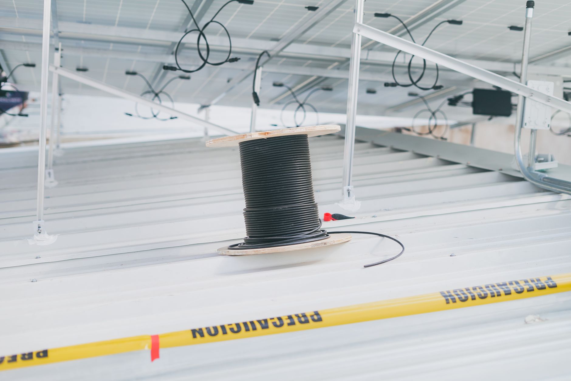 Sealed cable and pipe penetrations illustrate the details that an above-ceiling survey must document.