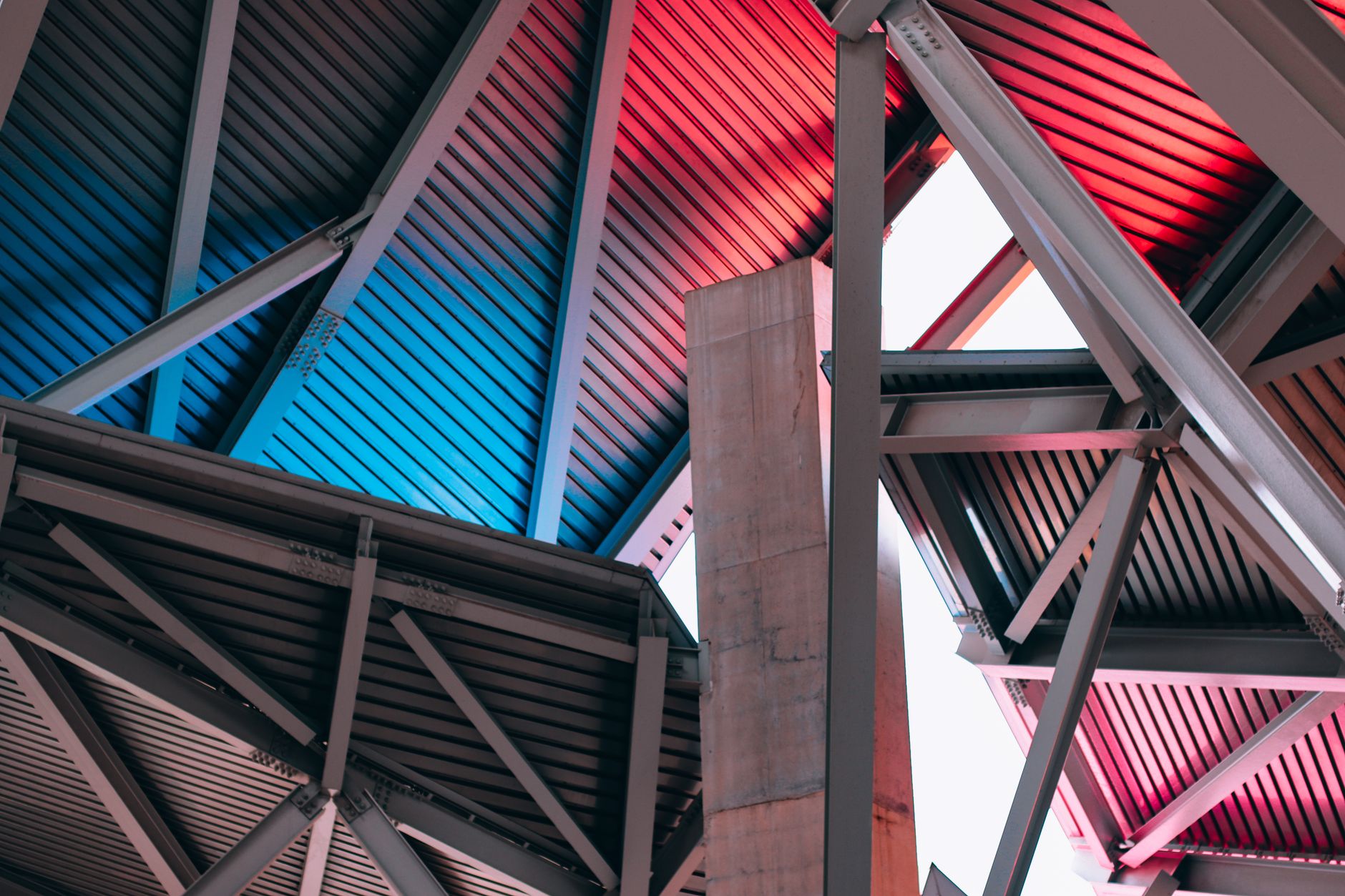 Open steel framing and deck overhead, the environment where SFRM coverage planning and photo routes are set.
