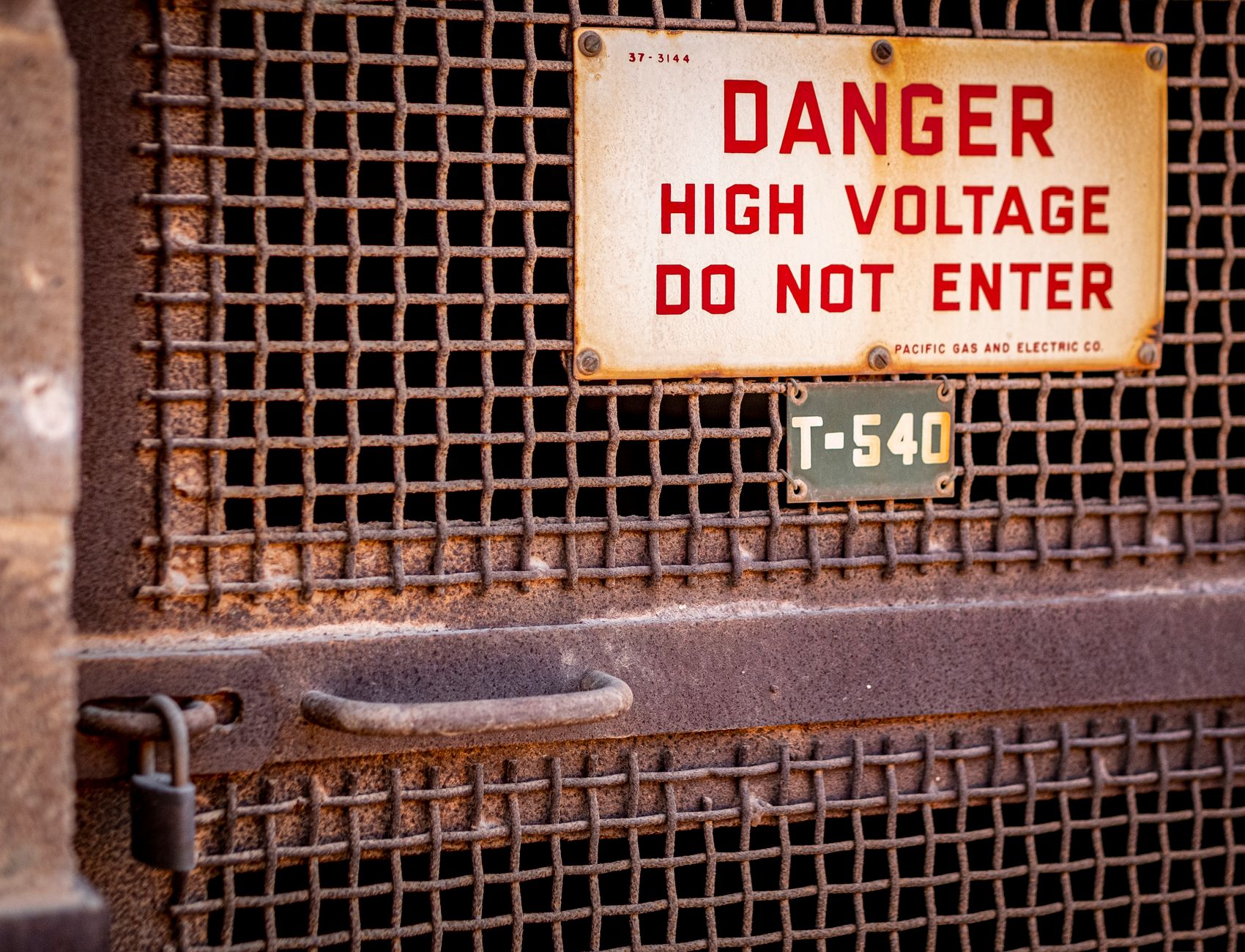 Lockout and tagout devices secure an electrical disconnect before an escalator pit inspection.