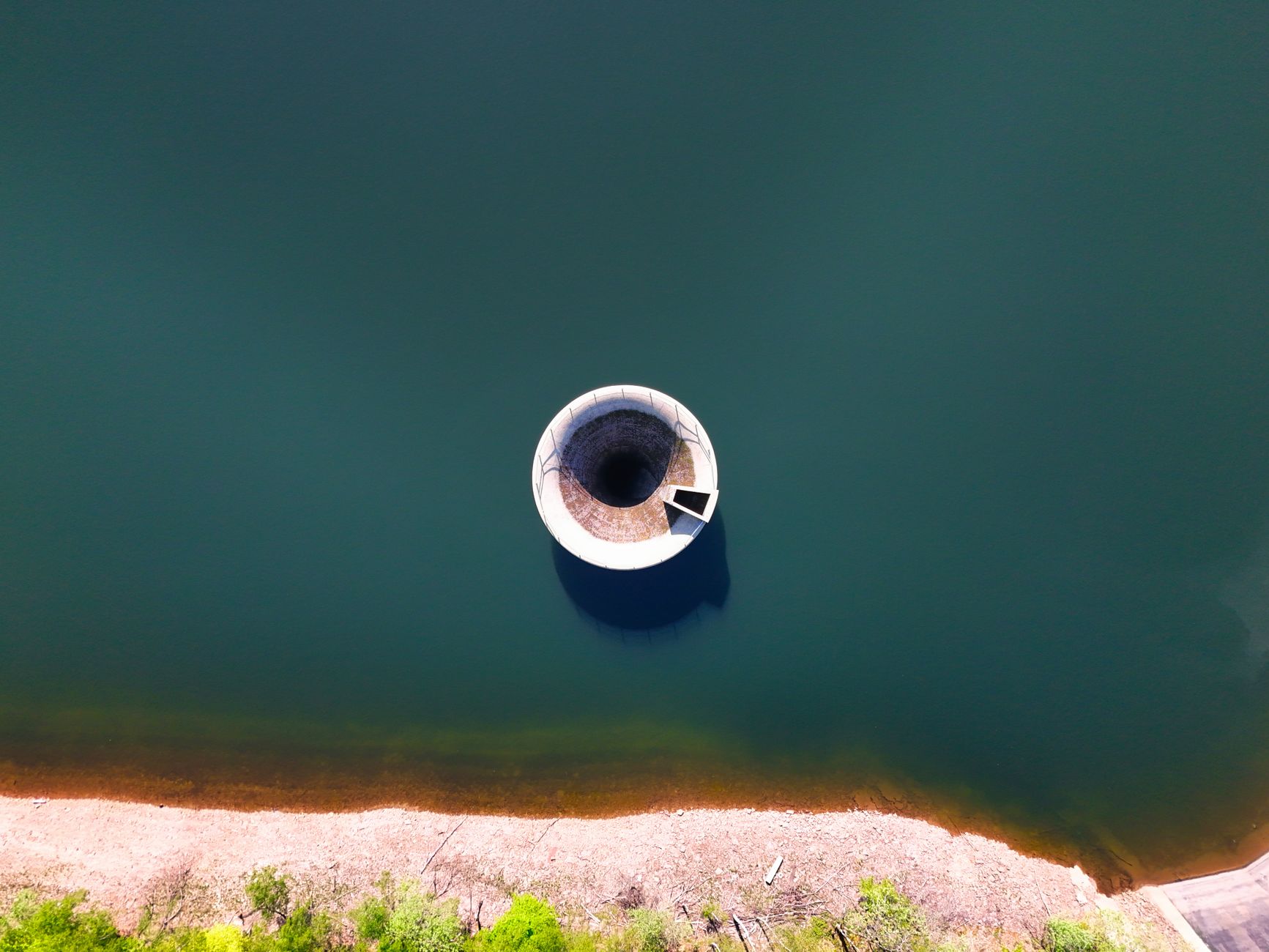 Large potable water reservoir interior where floor sediment and coating condition must be documented.