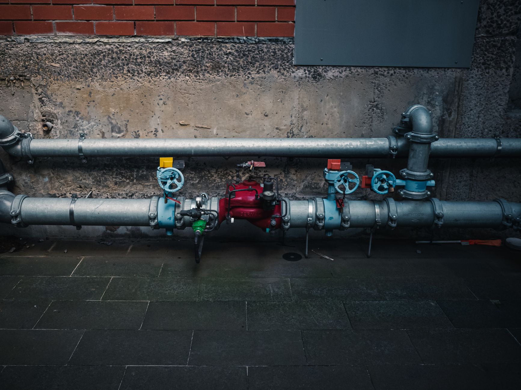 Manual isolation valves on industrial piping before interior inspection or purging begins.