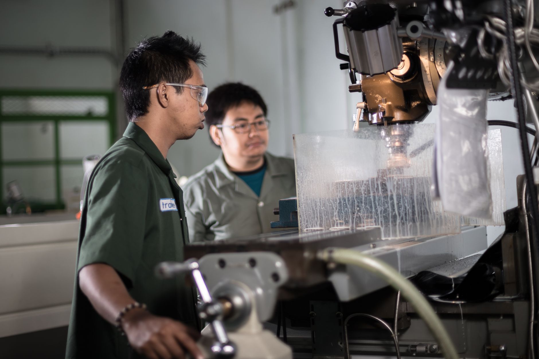 A technician photographs mechanical equipment from a controlled position to create a repeatable inspection record.