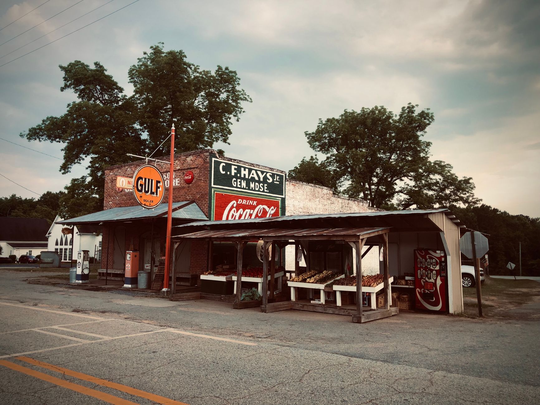 Small town storefront along a mountain highway at dusk