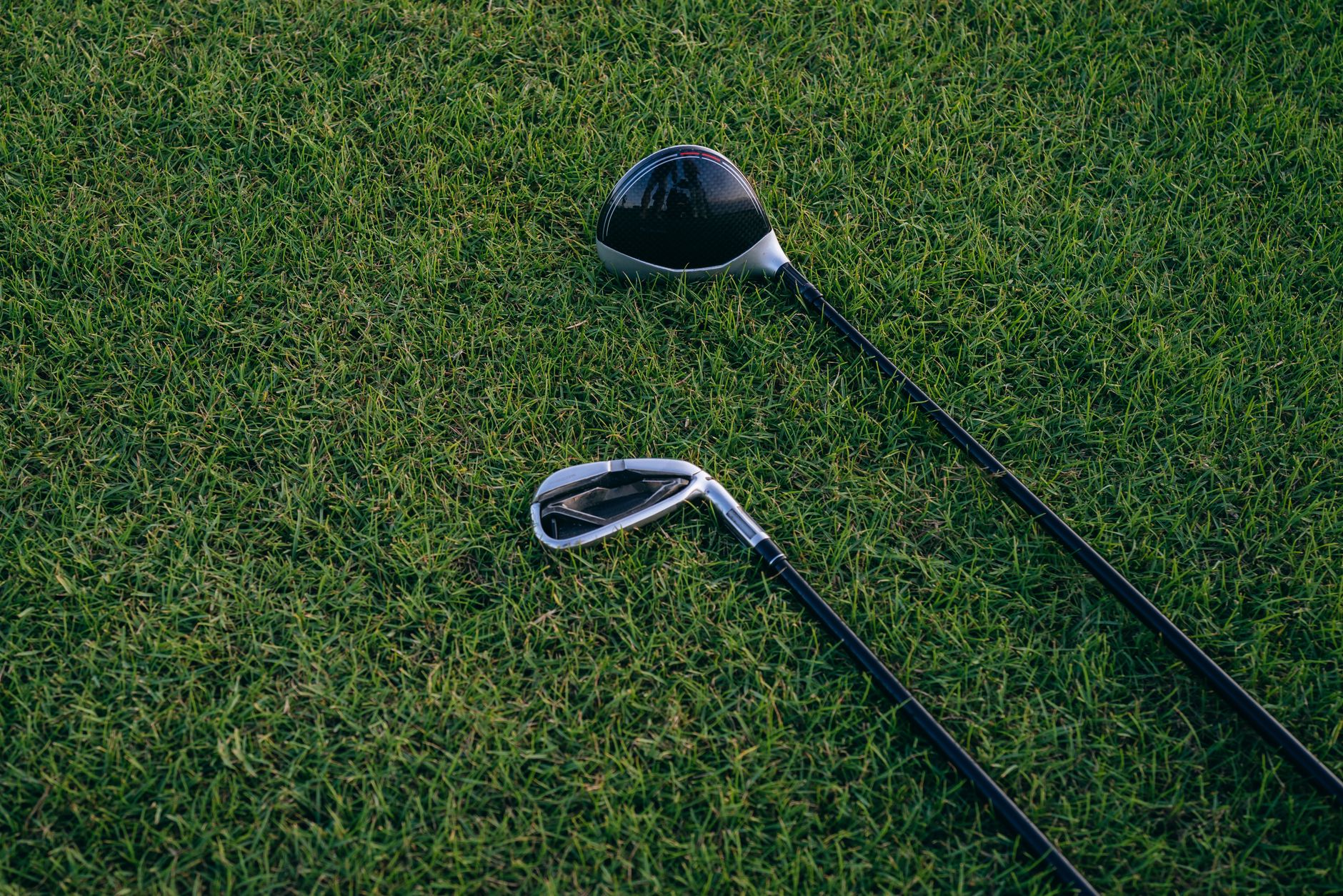 Both partners hitting at a selection point on a reachable fairway during Scotch doubles league play.