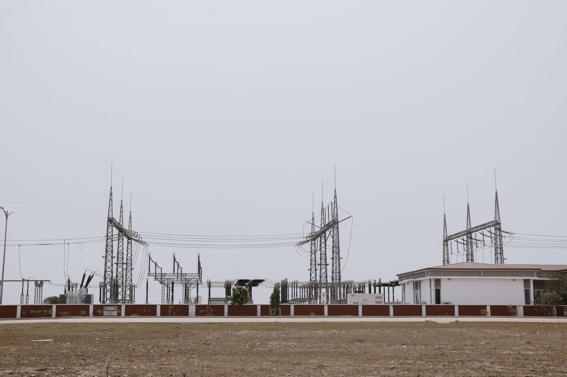 An outdoor electrical substation at night, where a thermal camera on a security robot could detect an intruder or identify overheating equipment.