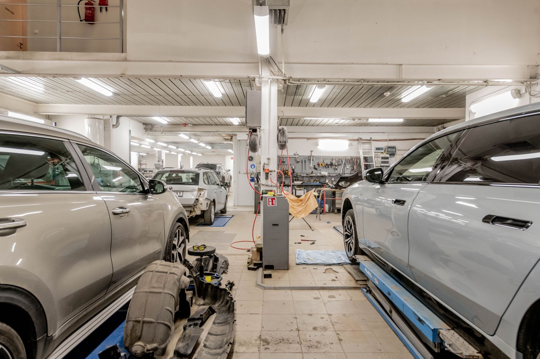 An empty and dark auto mechanic's service bay, representing another area of the dealership vulnerable to after-hours theft.