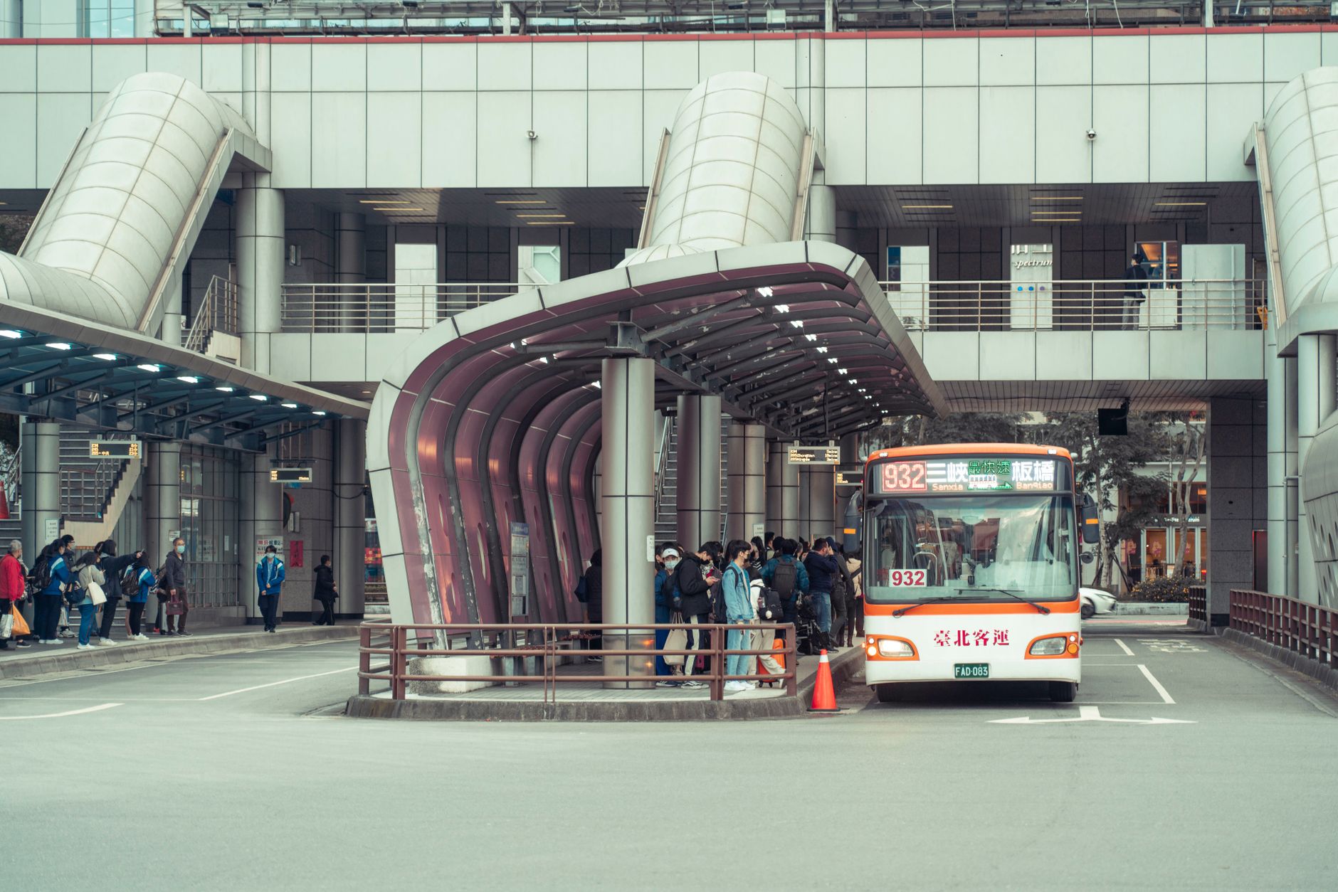 Outdoor bus platform and curb pickup zone that should appear as named patrol checkpoints.