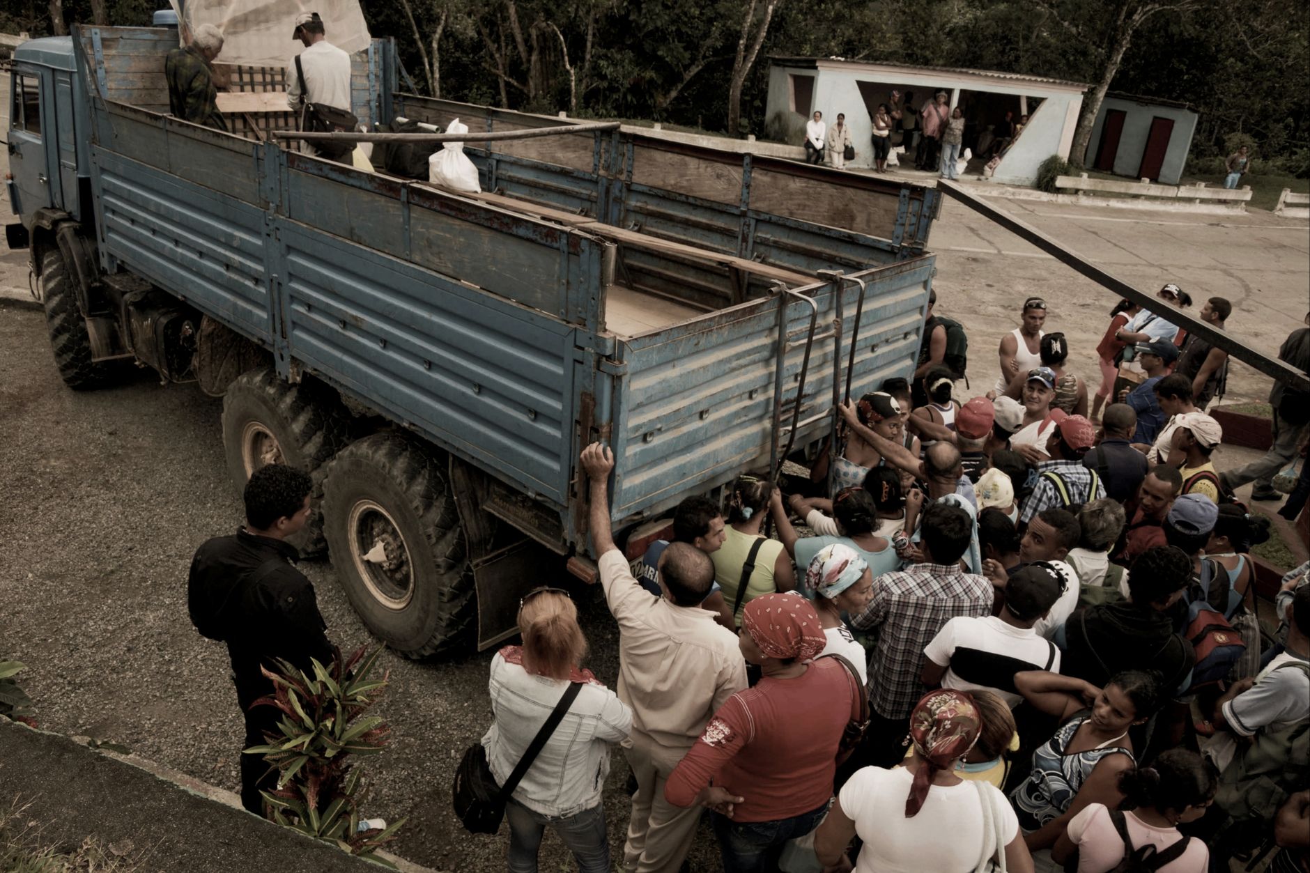 Trucks lined up near a terminal gate, illustrating how queueing and staging areas create visibility and access-control challenges.