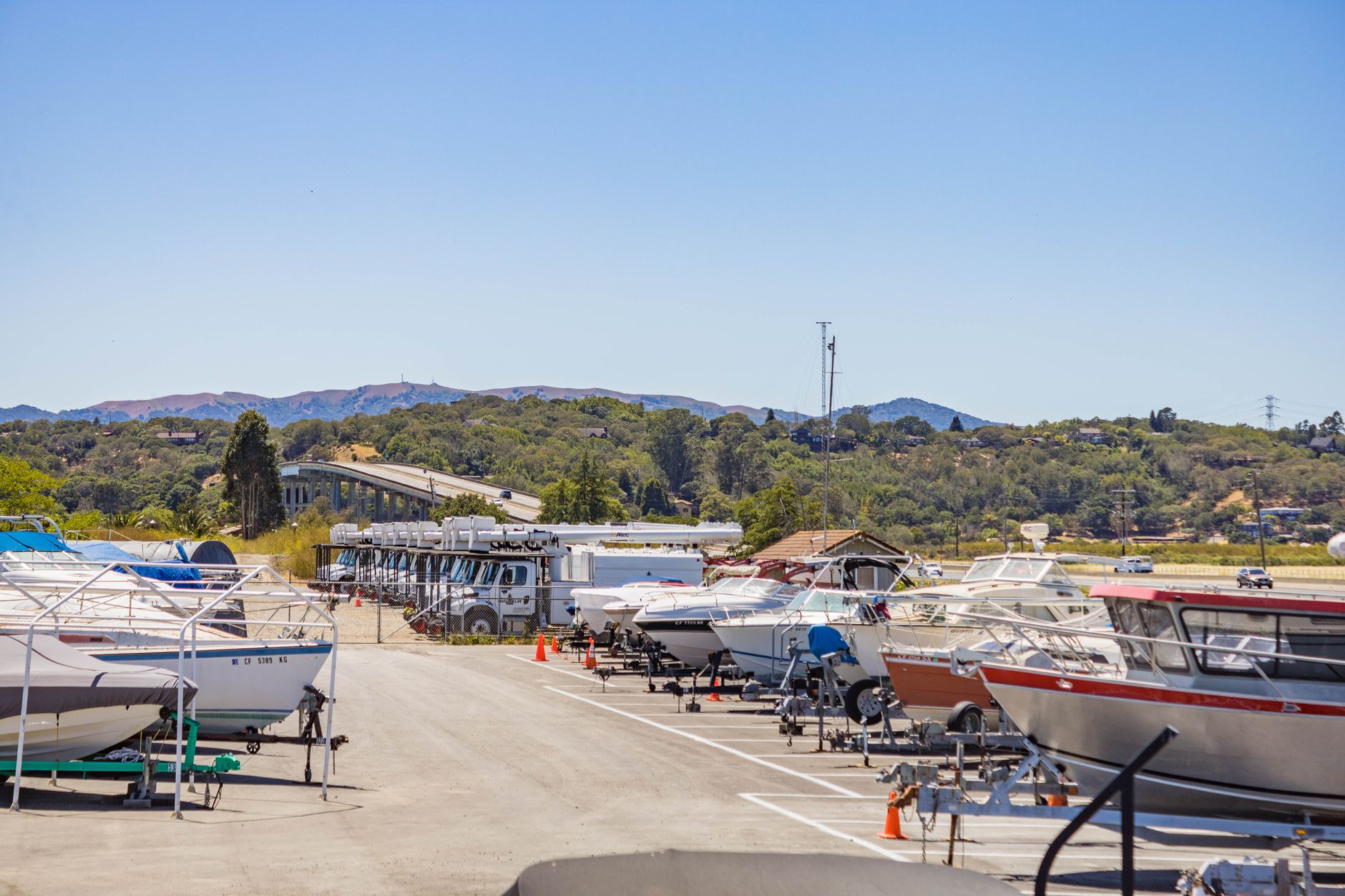 Rows of outdoor boat or RV storage on paved ground, showing the kind of predictable hardscape that suits repeatable patrol routes.